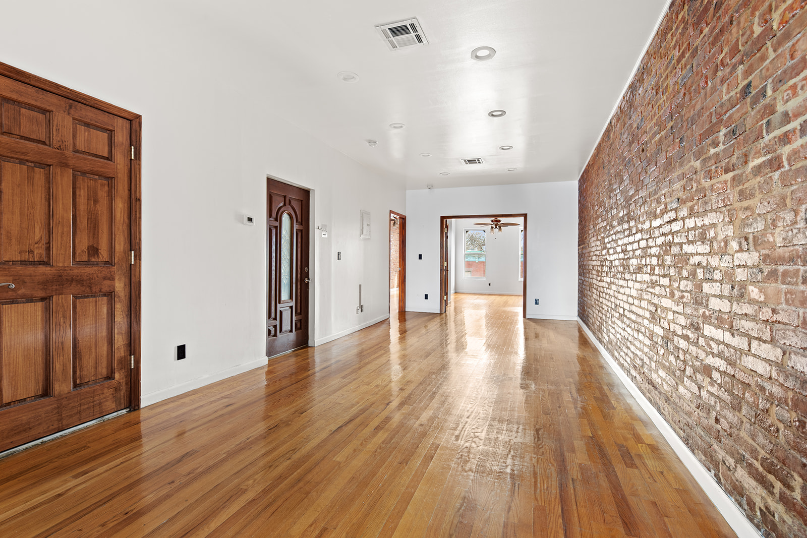 344 7th Avenue, Unit 3 Brooklyn, NY 11215 - Photo 3 of 9 a view of an empty room with wooden floor