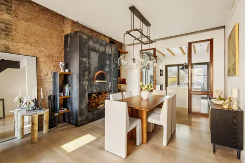 a view of a dining room with furniture window and outside view