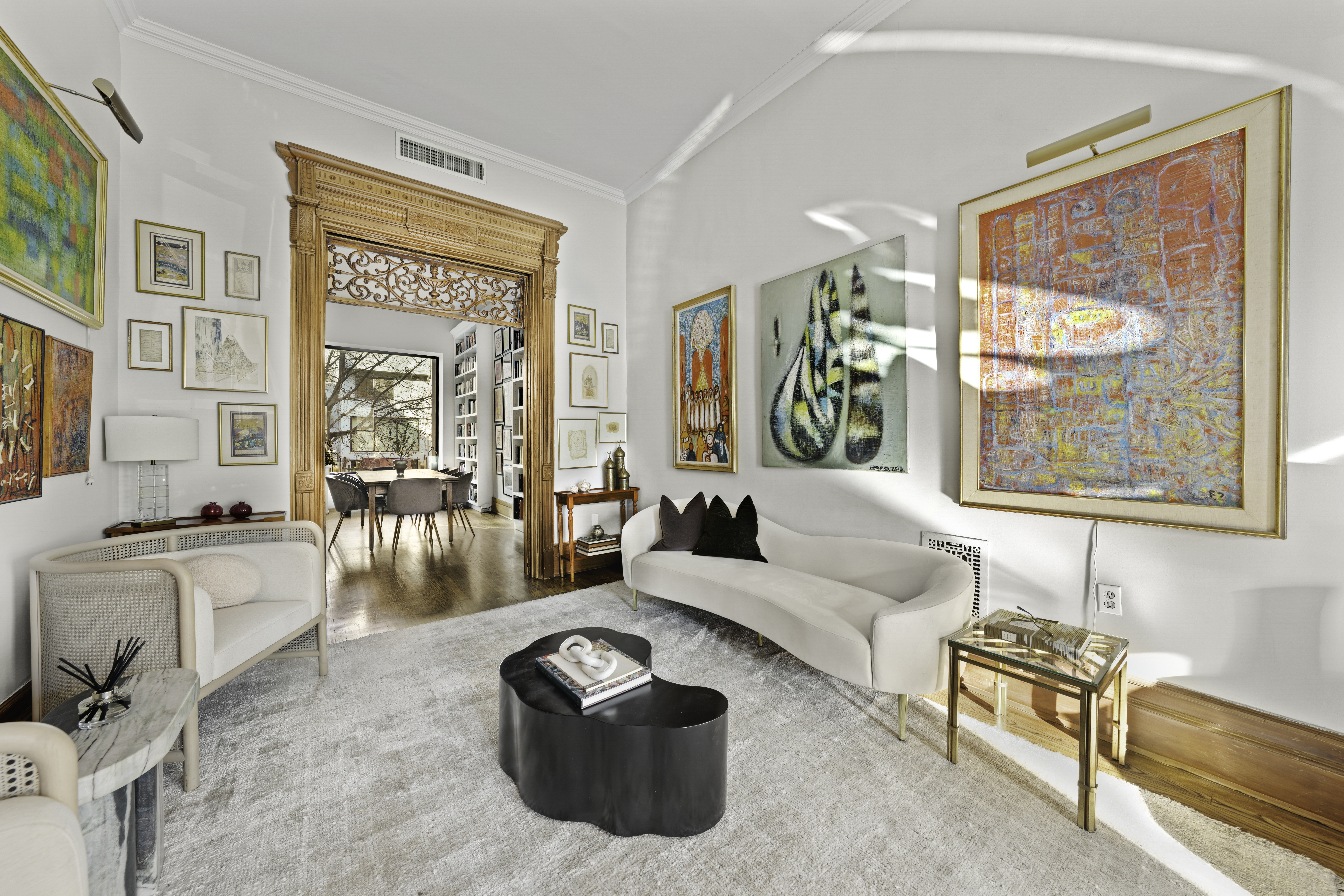 127 West 122nd Street Manhattan, NY 10027 - Photo 7 of 17 a living room with furniture and a large window