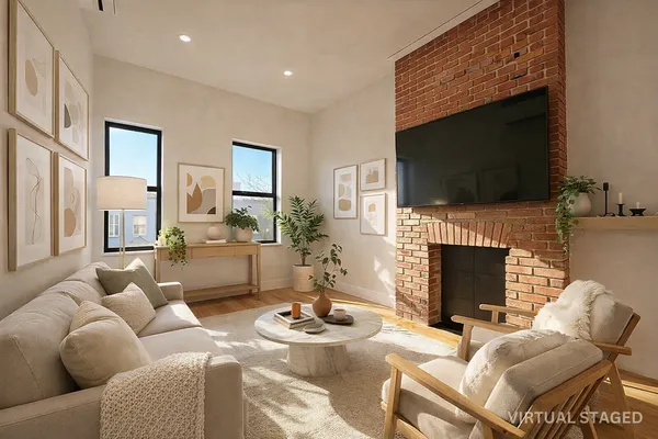 a living room with furniture a fireplace and a flat screen tv