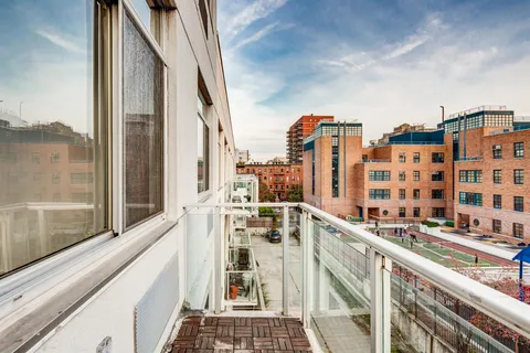 a view of a balcony with city view
