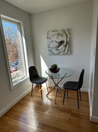 a view of a livingroom with furniture and a potted plant