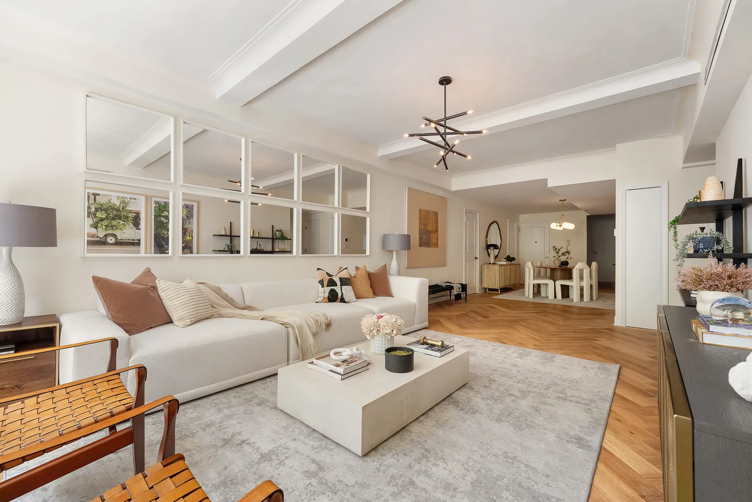 a living room with furniture ceiling fan and a rug