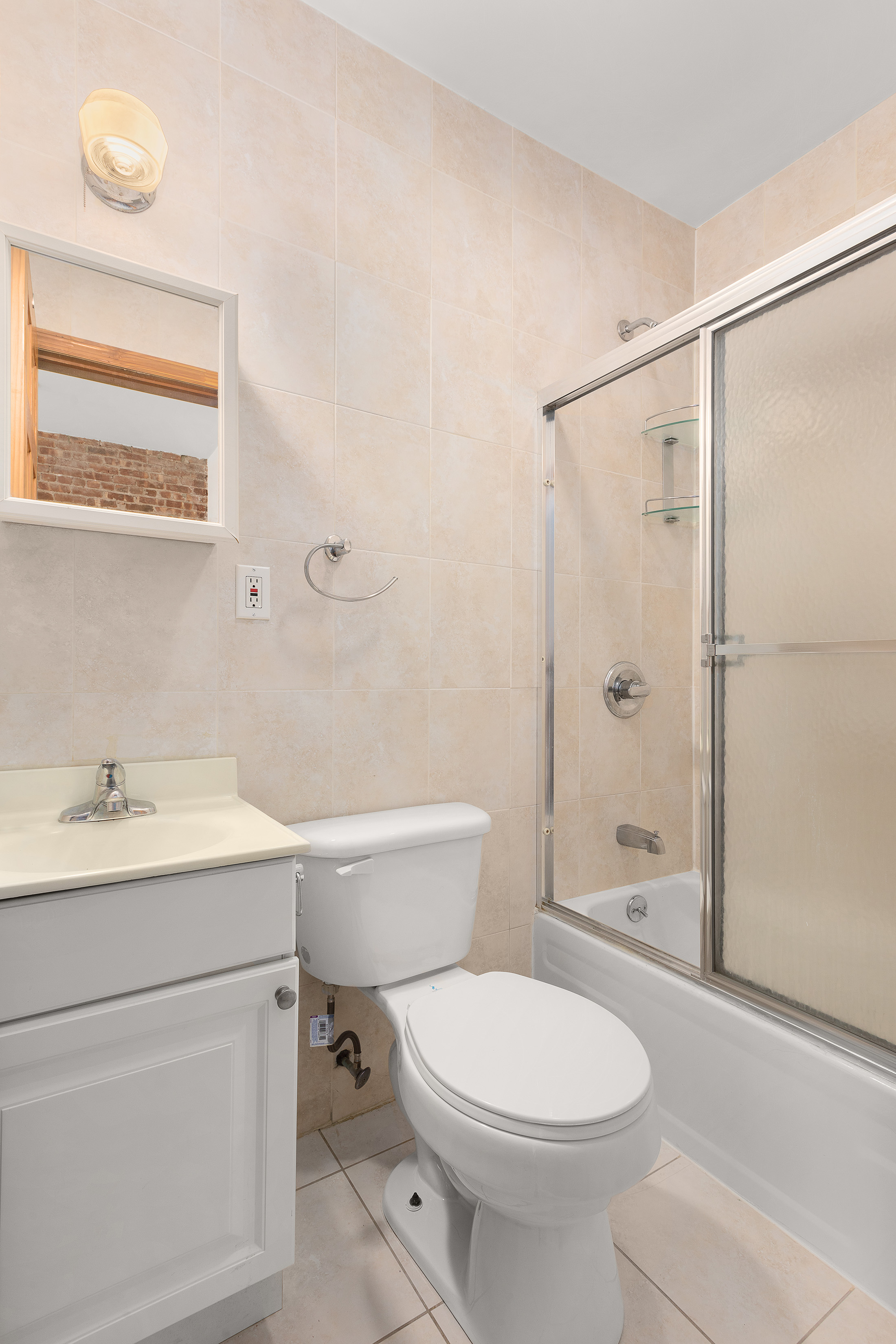 11-51 44th Drive, Unit 2 Queens, NY 11101 - Photo 6 of 6 a bathroom with a sink a toilet and shower