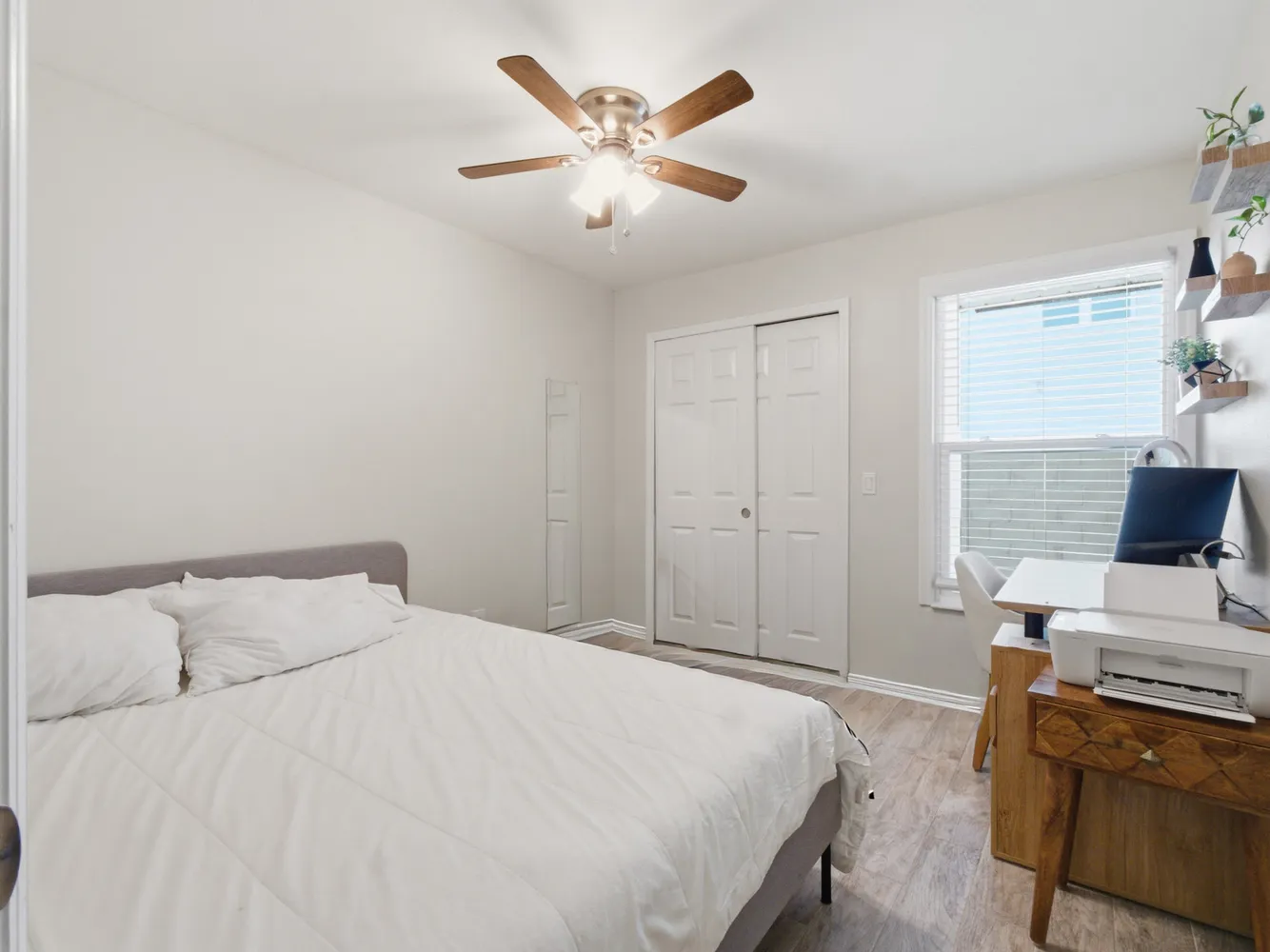 a bedroom with a bed and a window