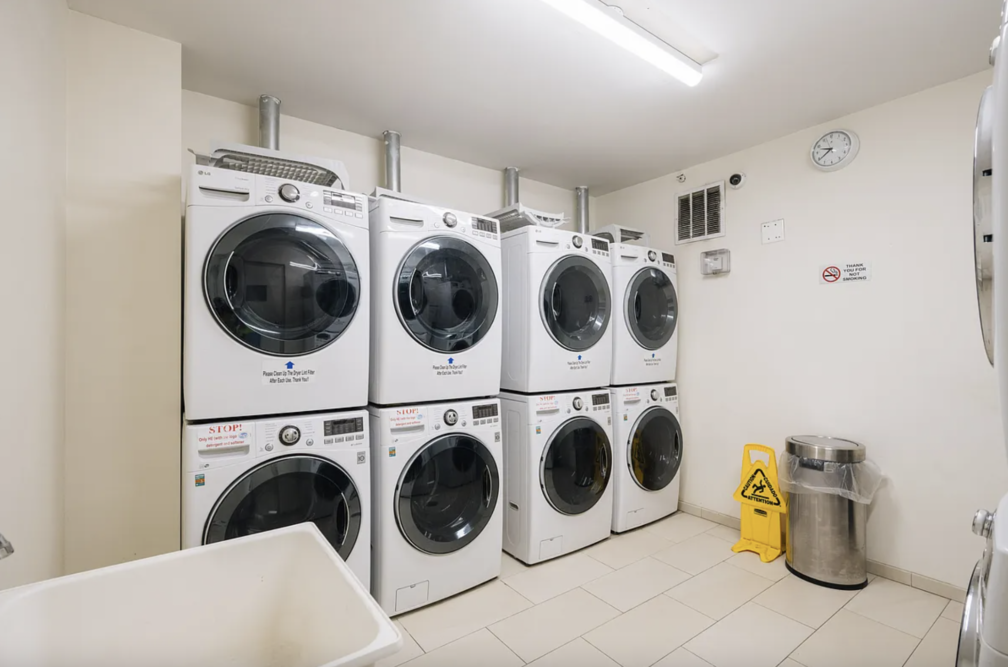 42-37 27th Street, Unit 8B Queens, NY 11101 - Photo 11 of 11 a utility room with dryer and washer