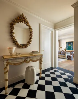 a room with a black white checkered floor