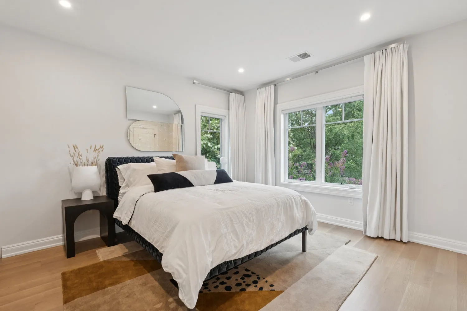 a bathroom with a granite countertop sink toilet a large mirror and shower