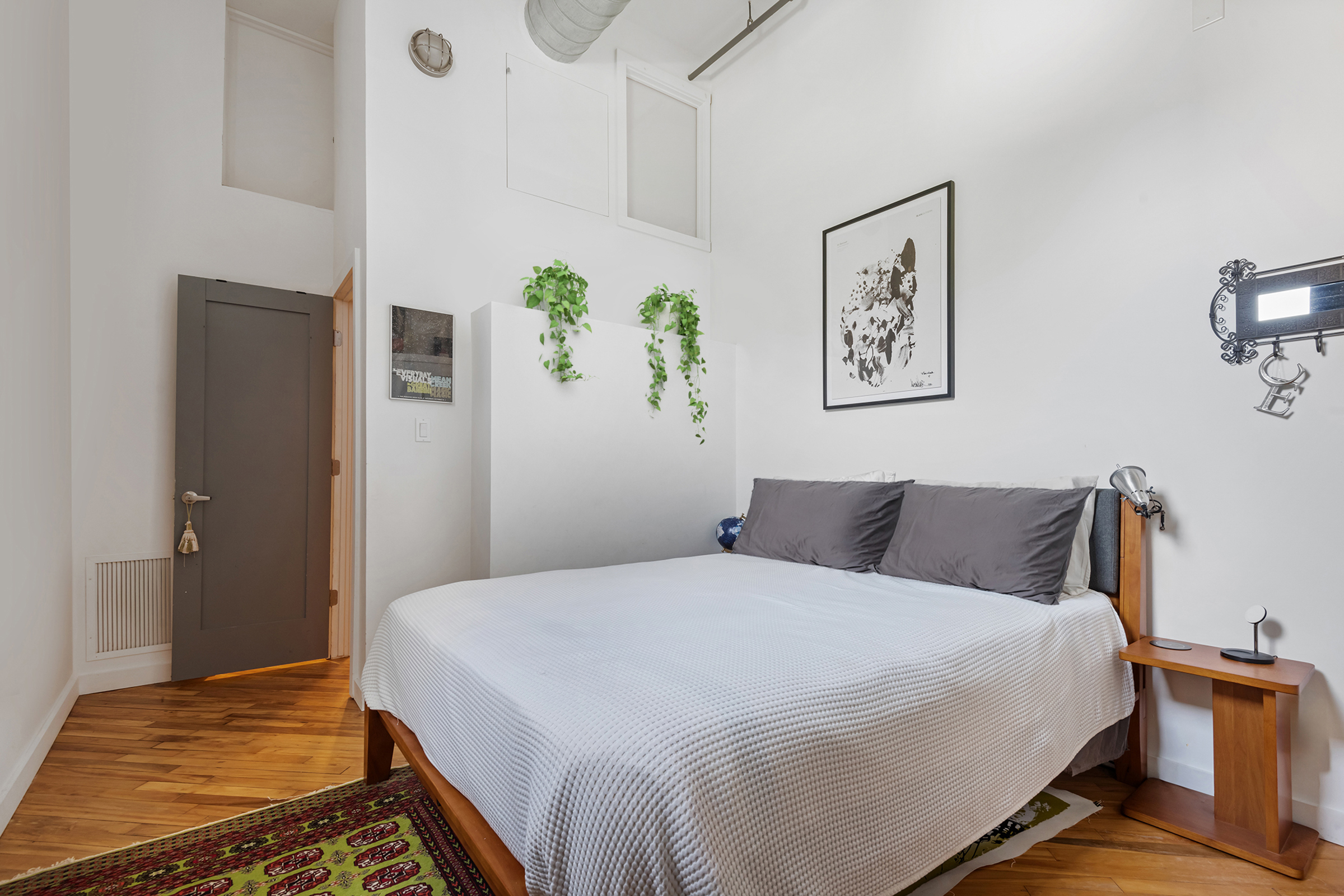 105 Lexington Avenue, Unit 2G Brooklyn, NY 11238 - Photo 12 of 17 a bedroom with a bed and painting on the wall