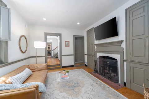 a living room with furniture and a fireplace