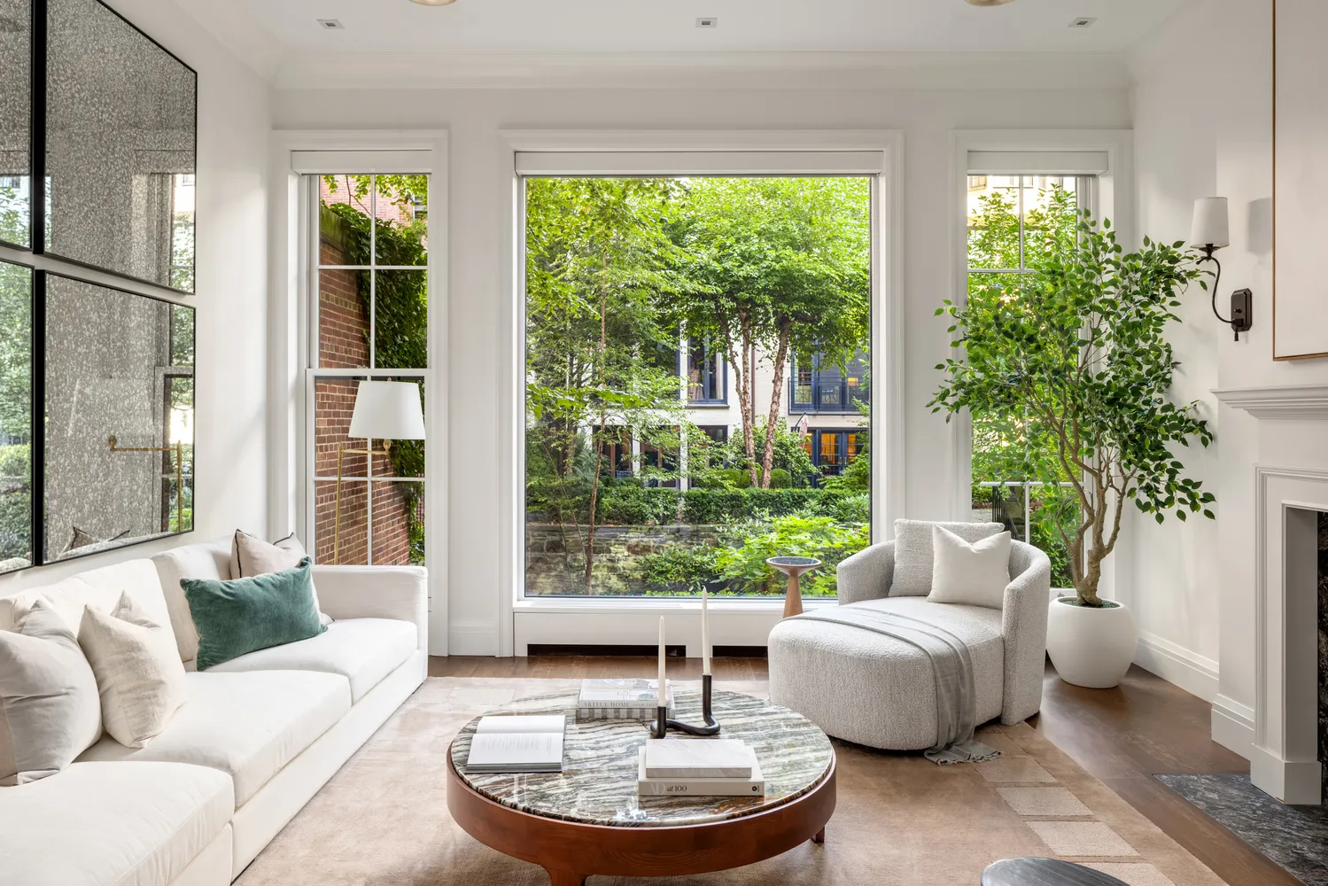 a living room with furniture and a potted plant