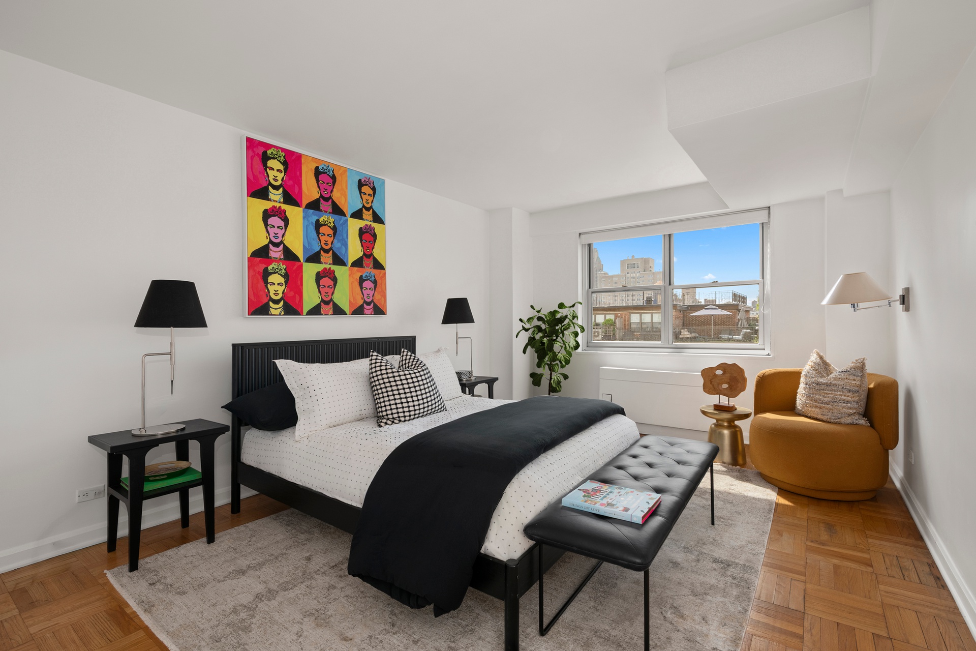 70 East 10th Street, Unit 15R Manhattan, NY 10003 - Photo 7 of 12 a bedroom with furniture and a couch