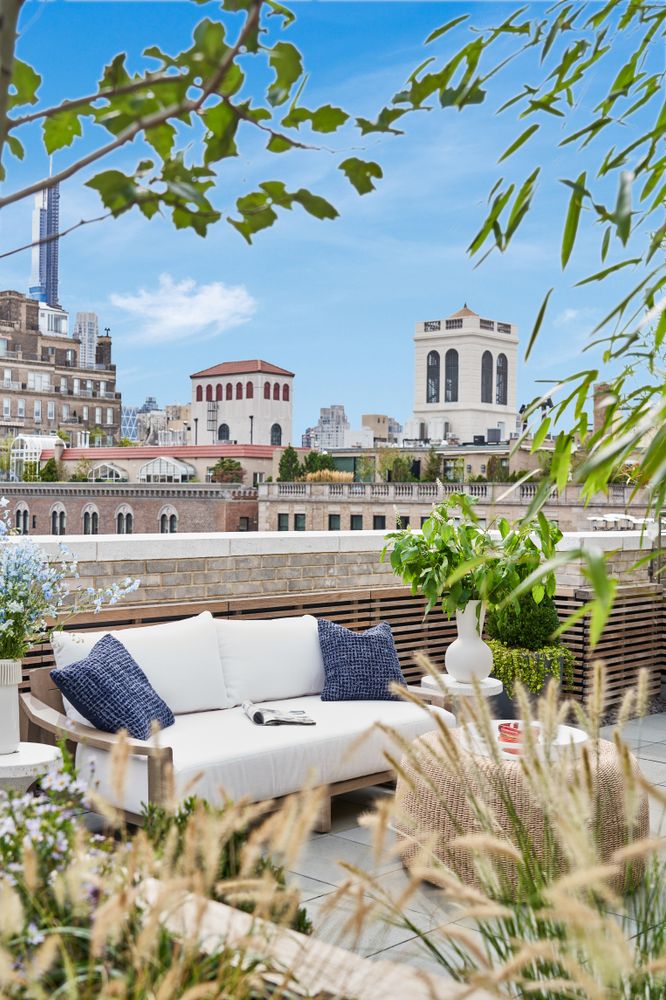 a view of a patio with couches and potted plants
