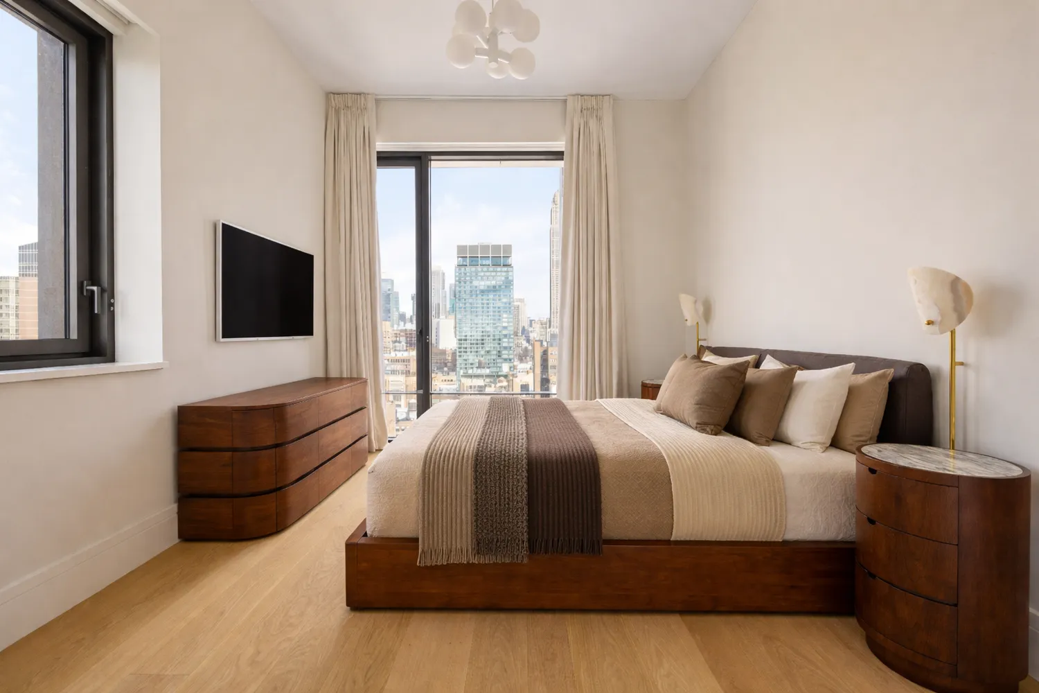 a bedroom with a bed window and couch