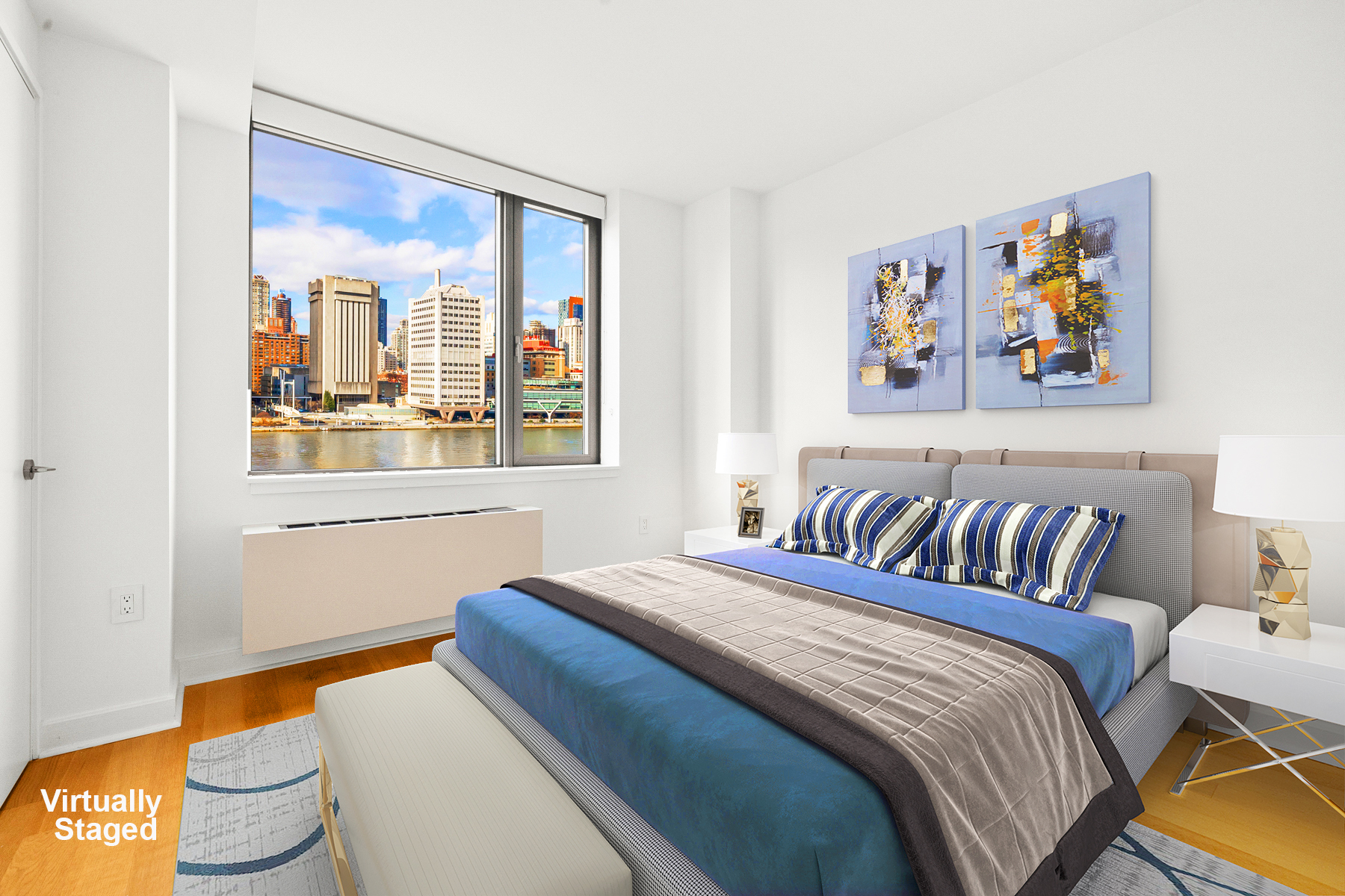 425 Main Street, Unit 9F Manhattan, NY 10044 - Photo 3 of 15 a bedroom with a bed and a painting on the wall