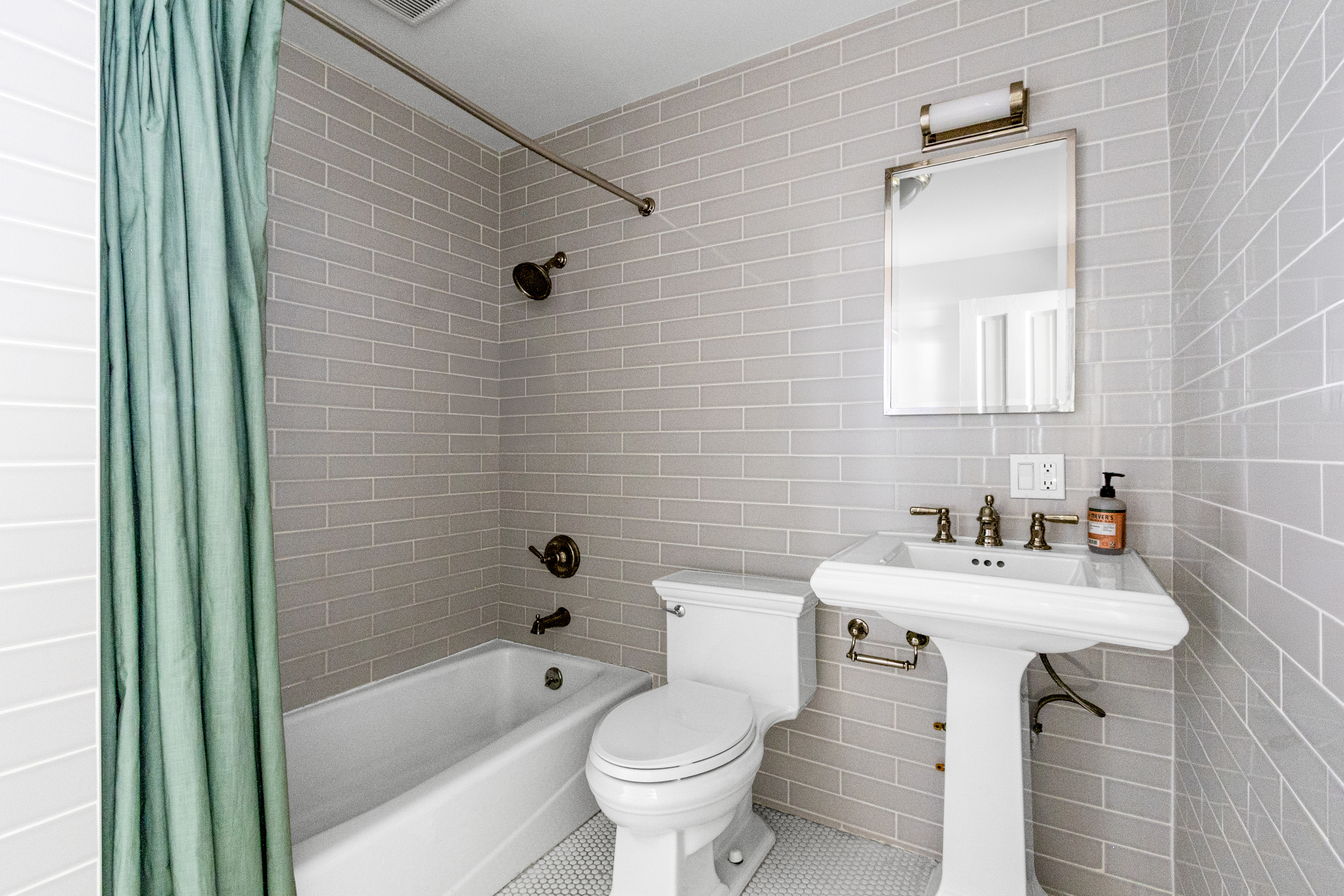 125 West 132nd Street Manhattan, NY 10027 - Photo 18 of 21 a bathroom with a sink toilet and shower