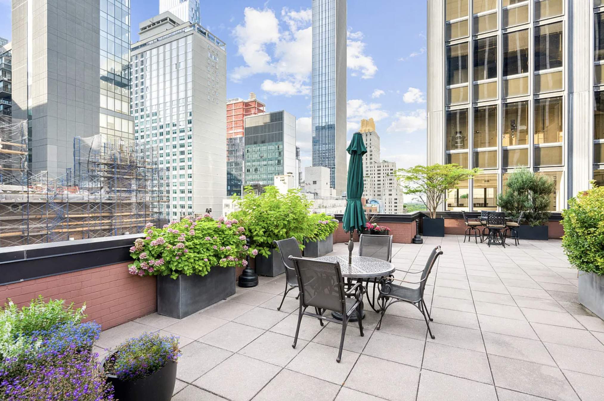 77 West 55th Street, Unit 11G Manhattan, NY 10019 - Photo 9 of 12 a view of a patio with plants and chairs