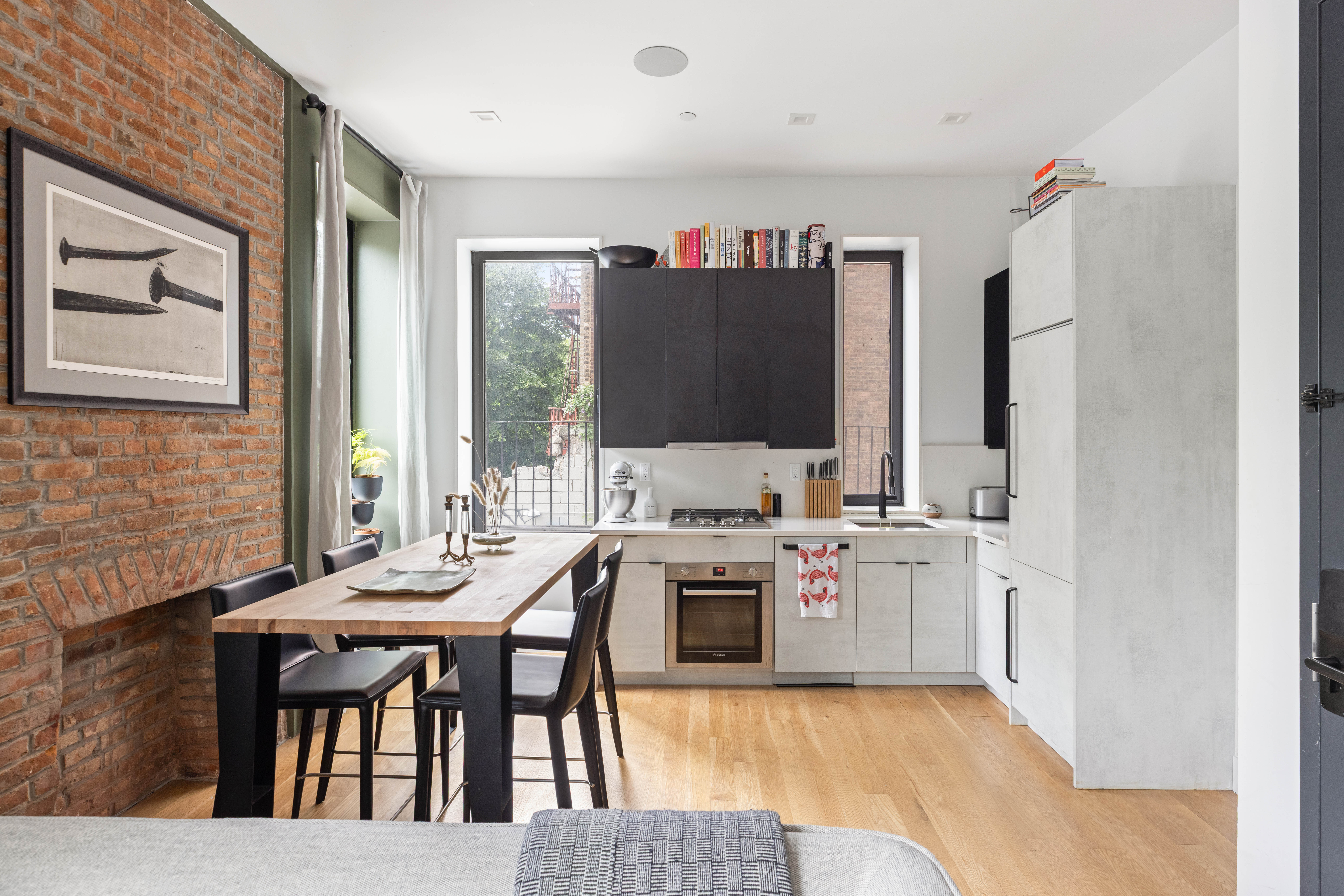 315 South 5th Street, Unit 2 Brooklyn, NY 11211 - Photo 3 of 10 a kitchen with a stove and a refrigerator