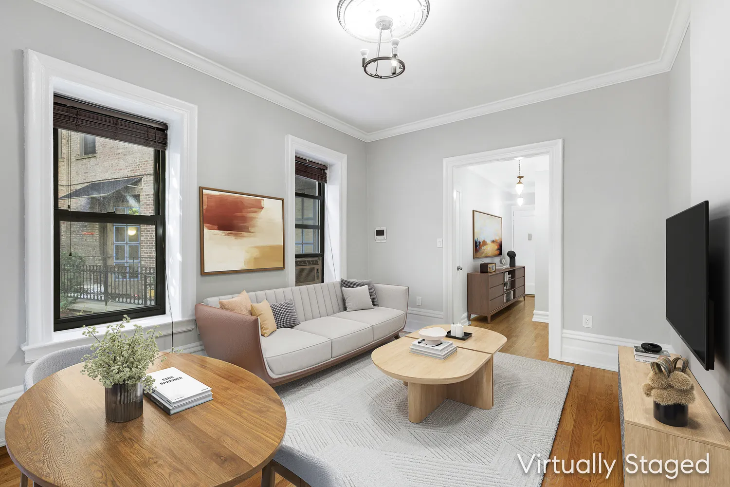 a living room with furniture and a flat screen tv