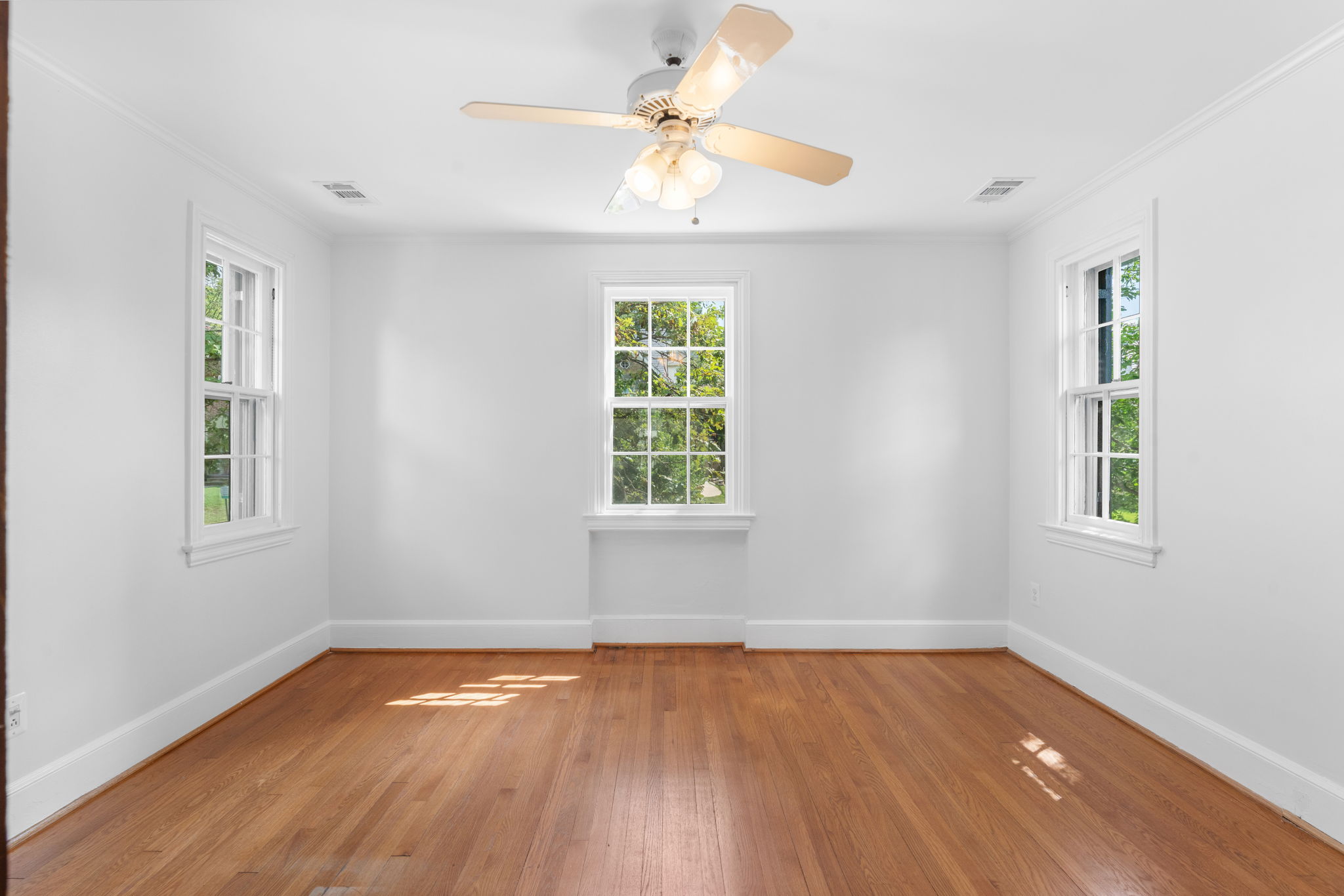 1325 Locust Road Northwest Washington, DC 20012 - Photo 37 of 56 a view of an empty room with wooden floor and a window