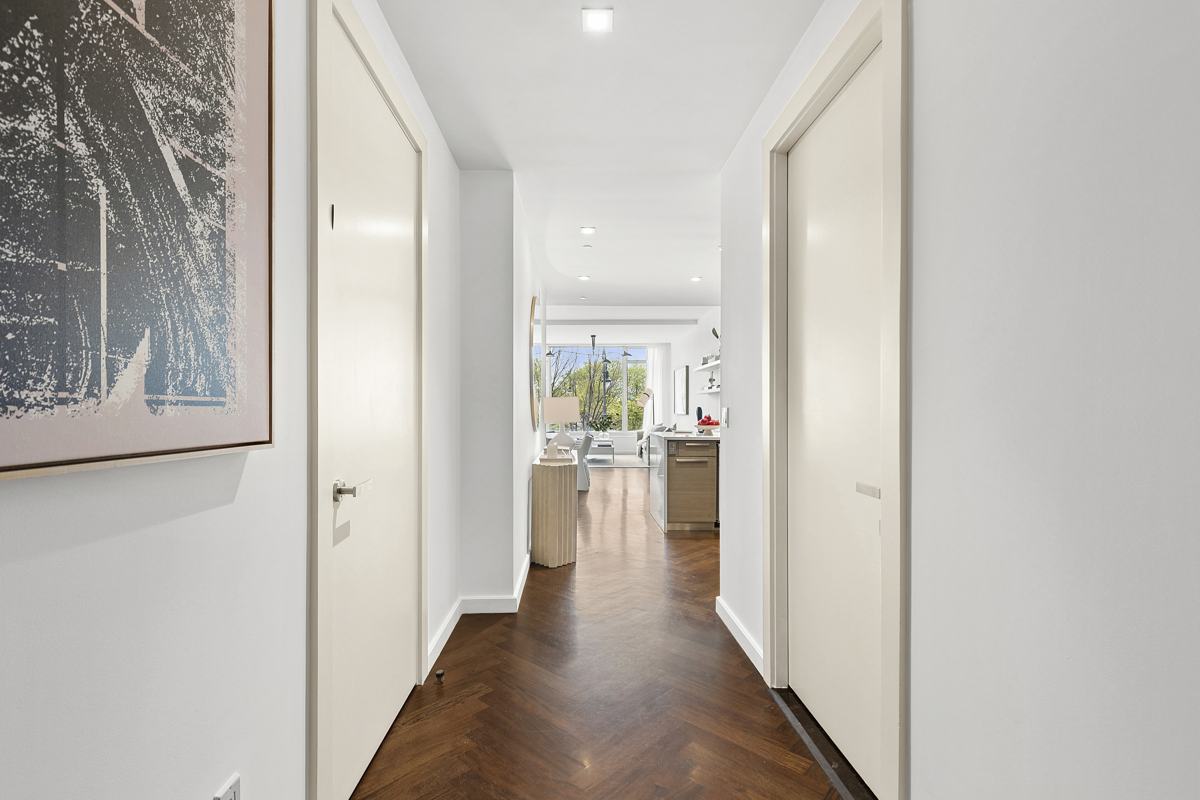 400 West 12th Street, Unit 3E Manhattan, NY 10014 - Photo 10 of 11 a view of a hallway with a dining table & chairs