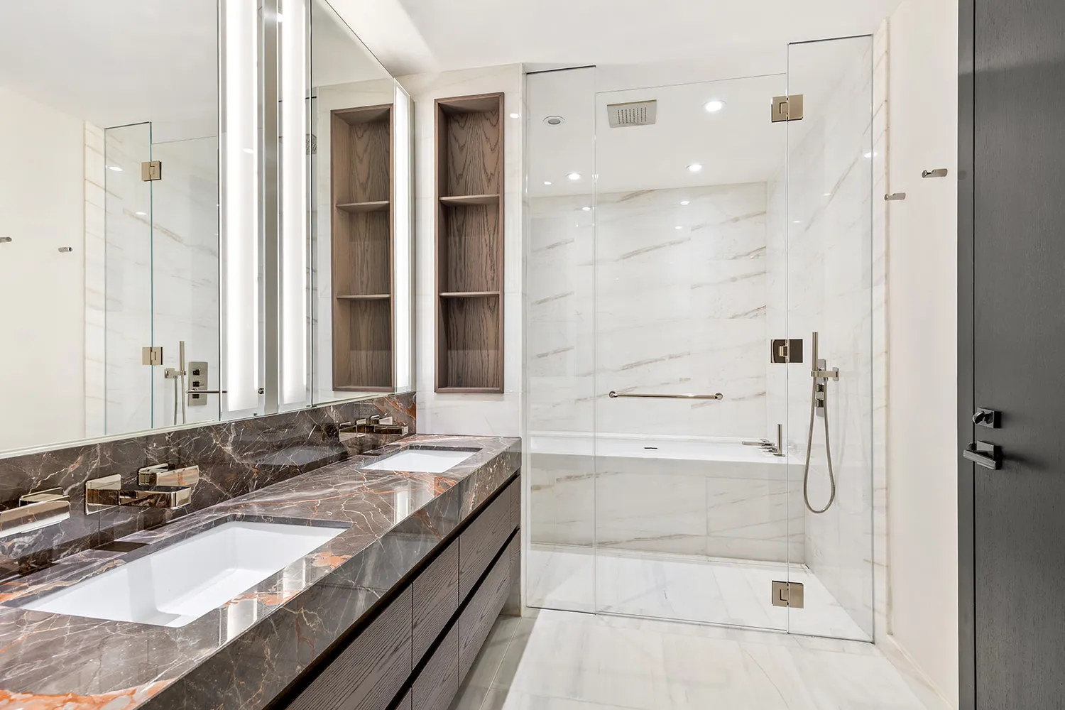 a bathroom with a bathtub shower sink and mirror