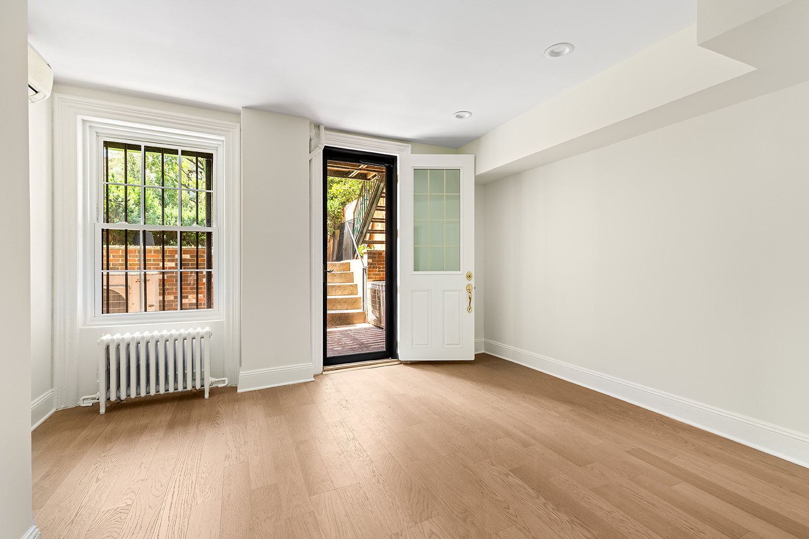 370 Carlton Avenue, Unit GARDEN Brooklyn, NY 11238 - Photo 3 of 7 an empty room with windows