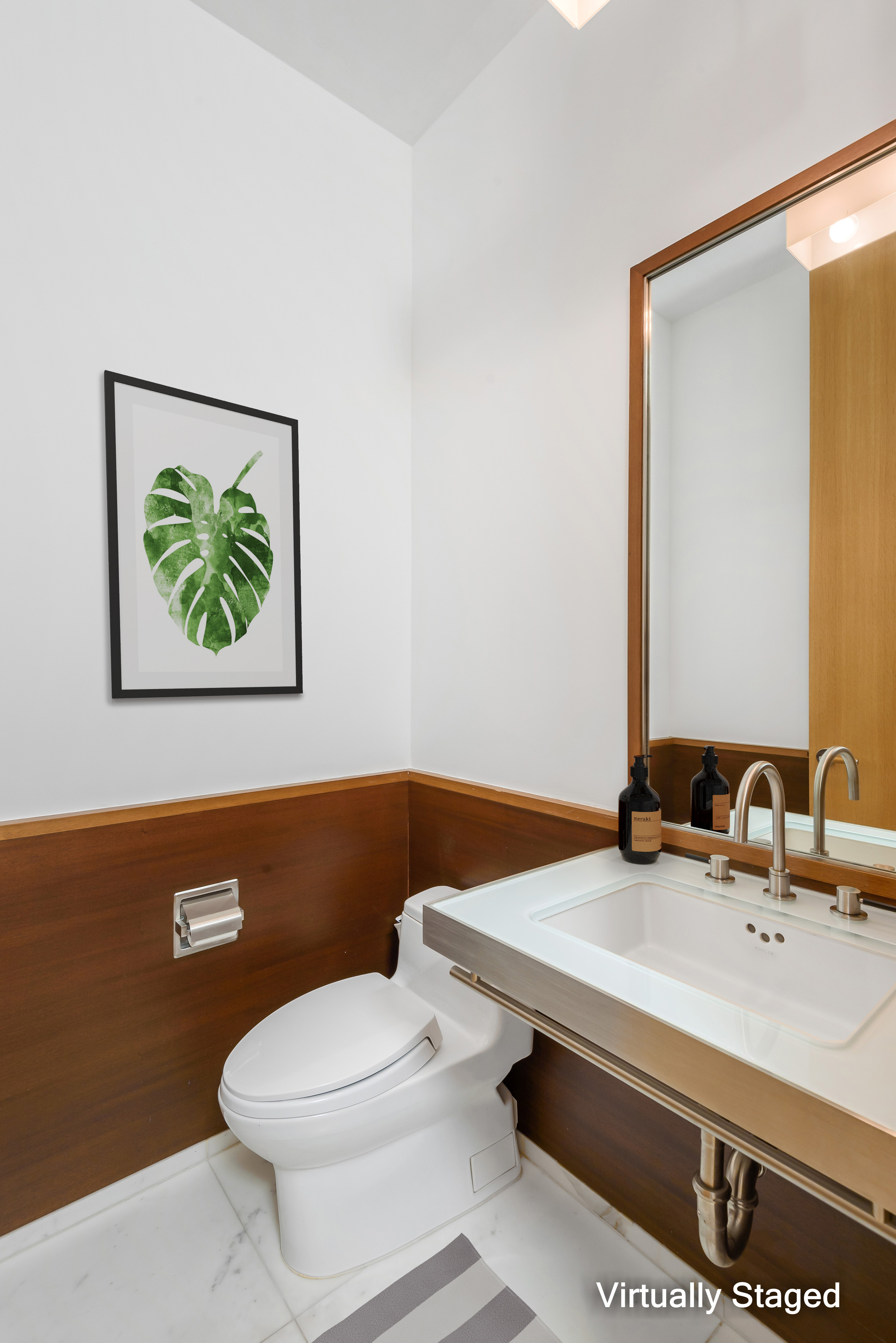 40 Mercer Street, Unit 19 Manhattan, NY 10013 - Photo 10 of 16 a bathroom with a sink mirror and toilet