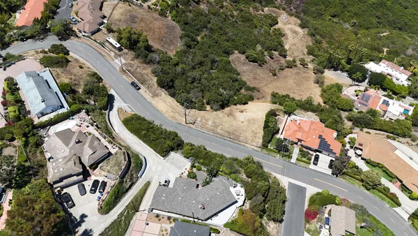 an aerial view of a house with outdoor space