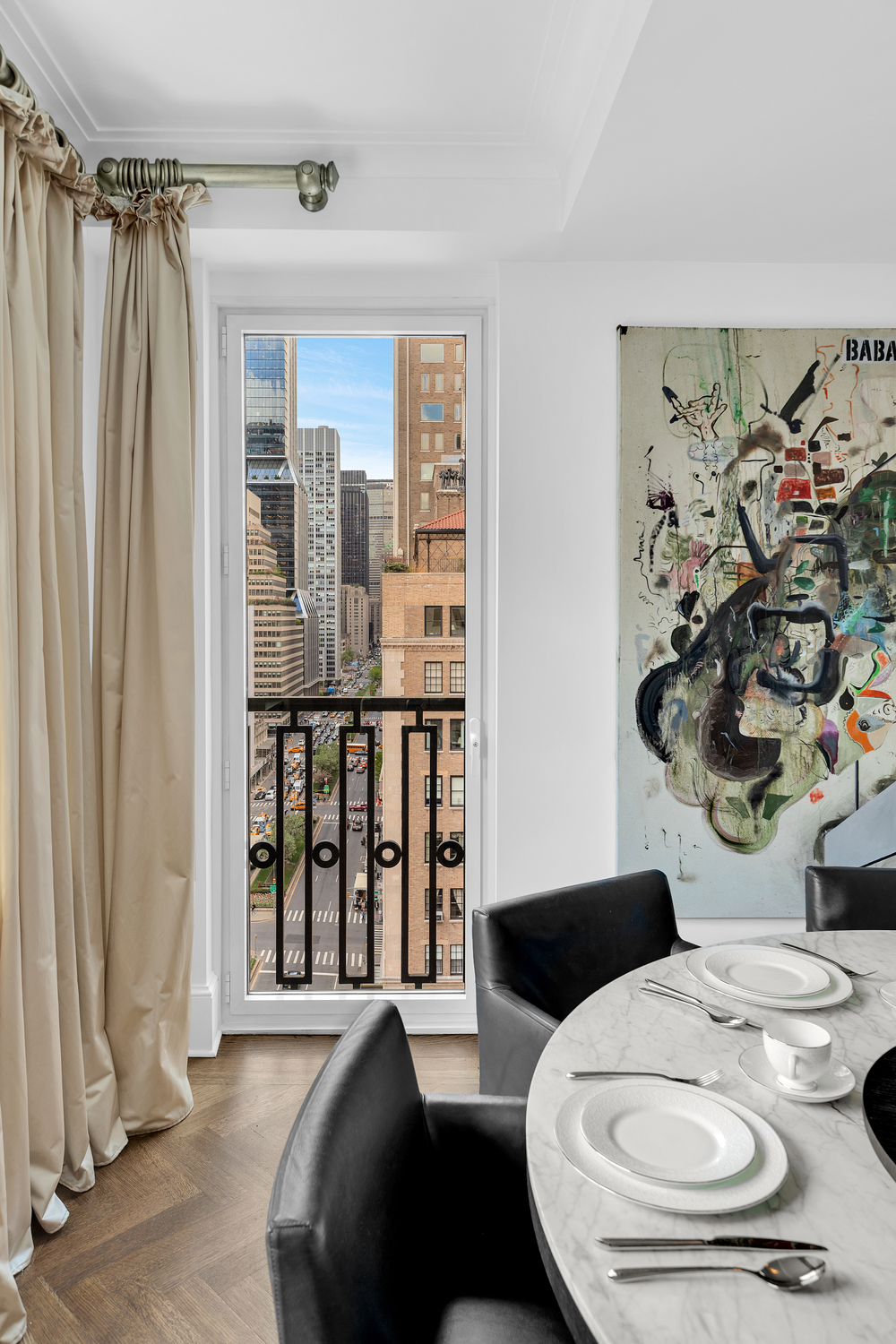 530 Park Avenue, Unit 17A Manhattan, NY 10065 - Photo 4 of 22 a living room with furniture and wooden floor