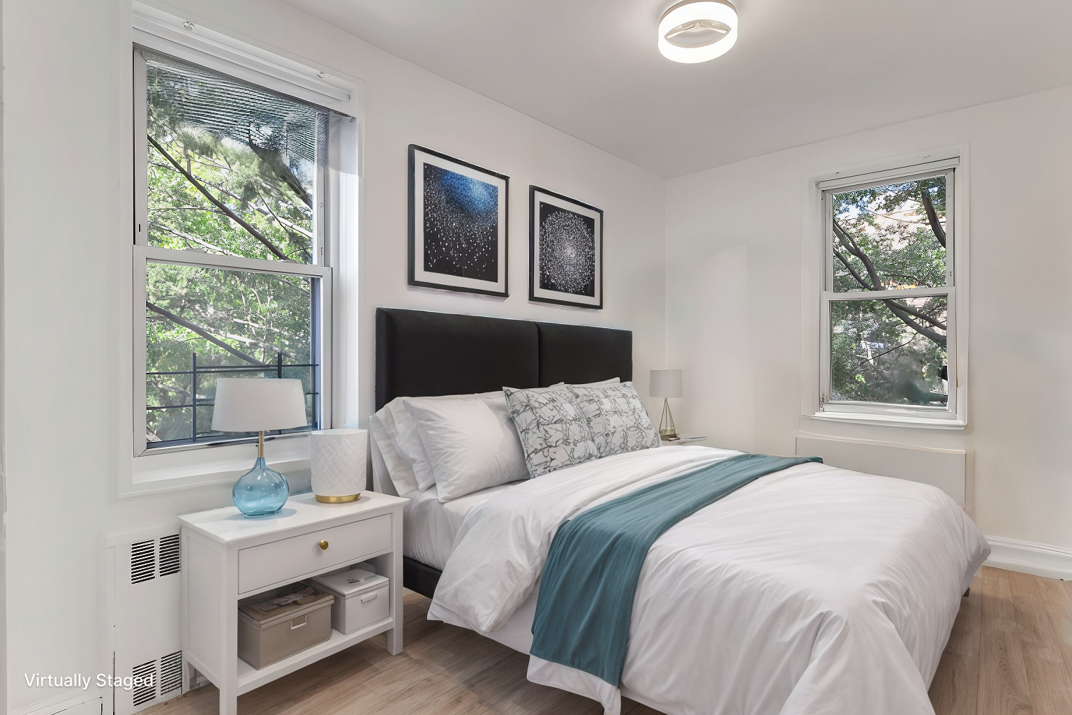 35-50 75th Street, Unit 5G Queens, NY 11372 - Photo 6 of 8 a bedroom with a bed and a window