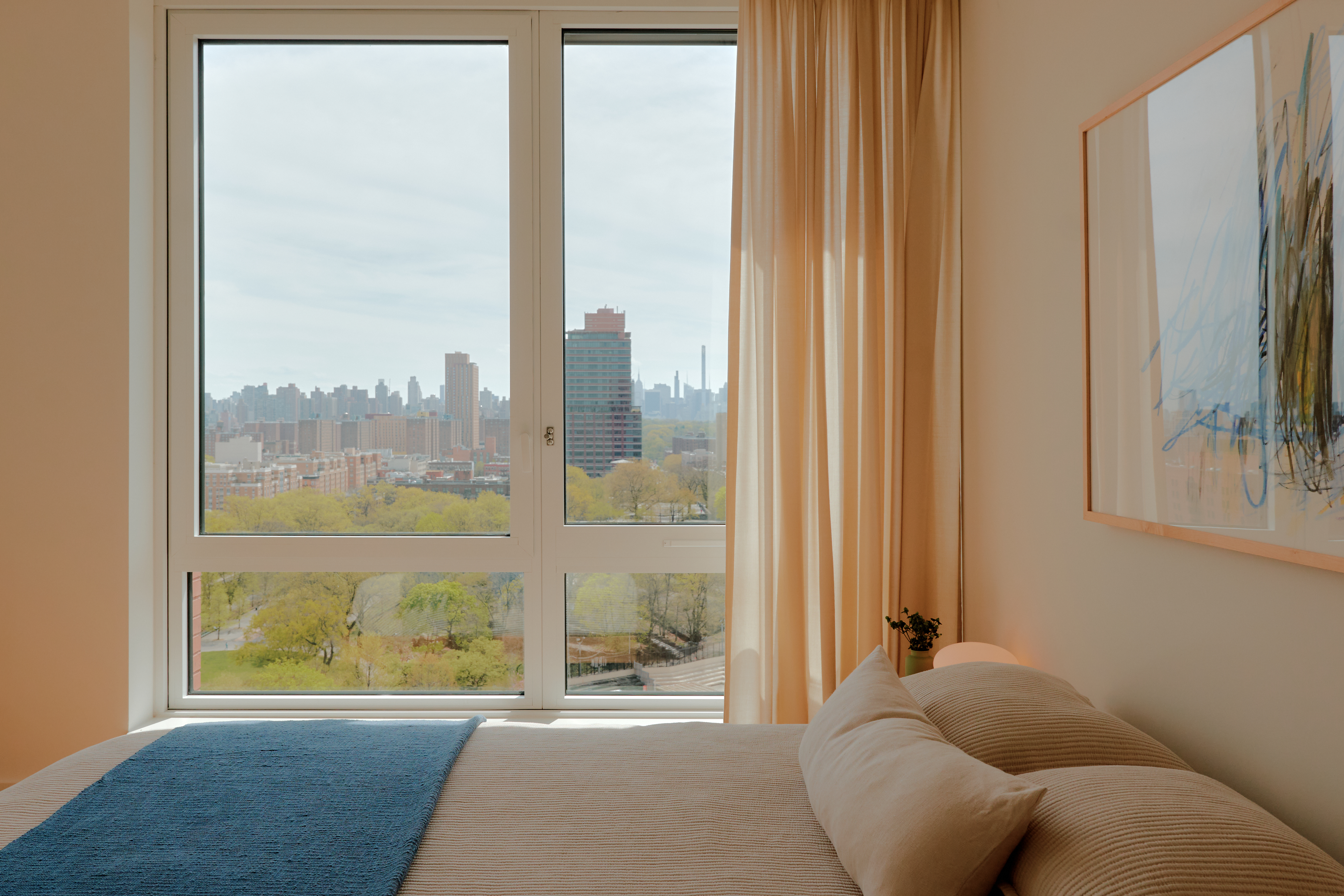 2035 5th Avenue, Unit 14M Manhattan, NY 10035 - Photo 3 of 14 a living room with furniture and a large window