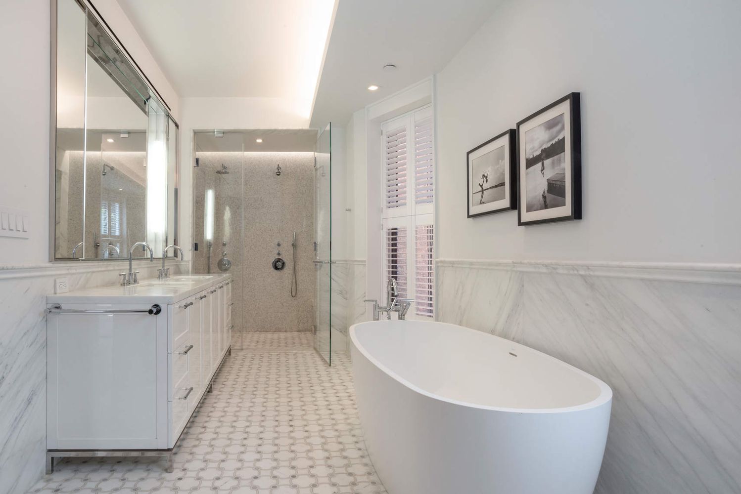 182 West 82nd Street, Unit 4E Manhattan, NY 10024 - Photo 13 of 25 a spacious bathroom with a bathtub a sink and a mirror