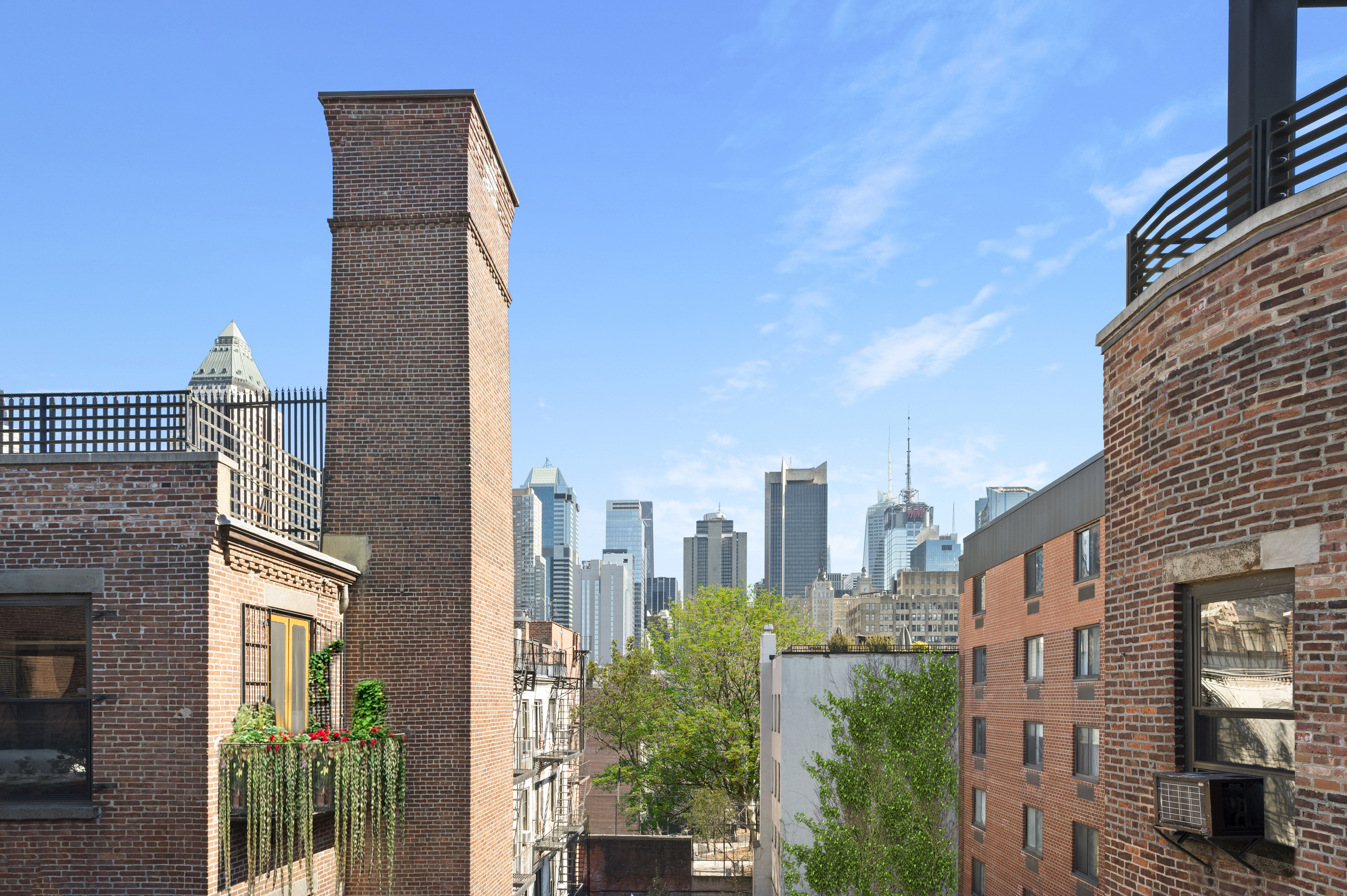 454 West 46th Street, Unit 5CS Manhattan, NY 10036 - Photo 11 of 25 a city street lined with tall buildings