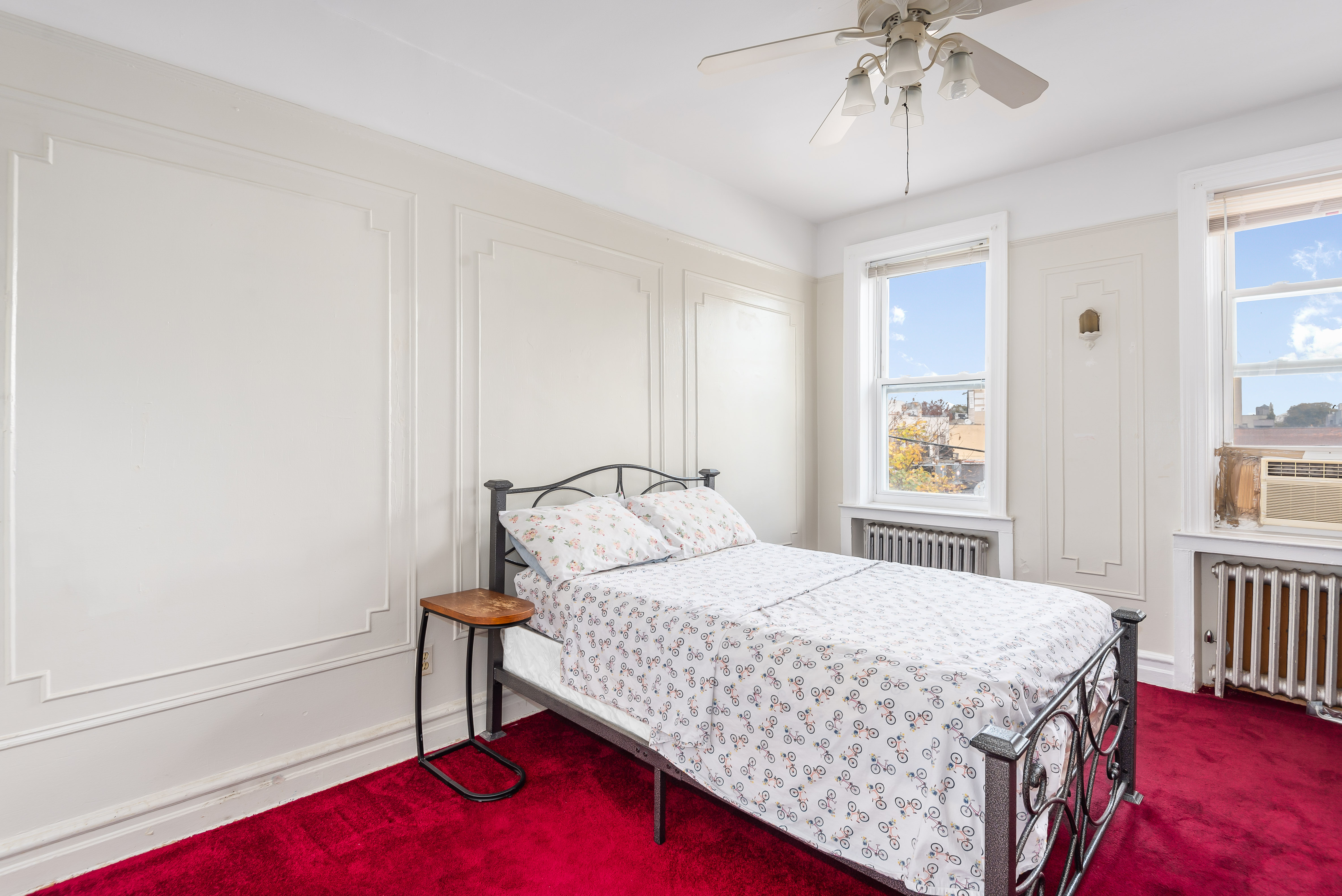 15 Lloyd Street Brooklyn, NY 11226 - Photo 9 of 18 a bedroom with a bed and a window