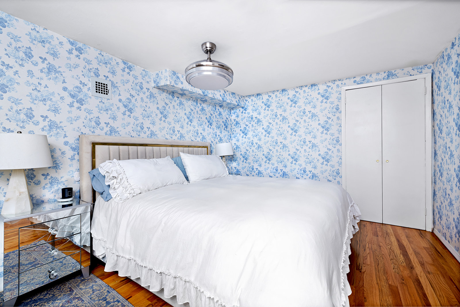 211 Thompson Street, Unit LJ Manhattan, NY 10012 - Photo 5 of 7 a bedroom with bed and wooden floor