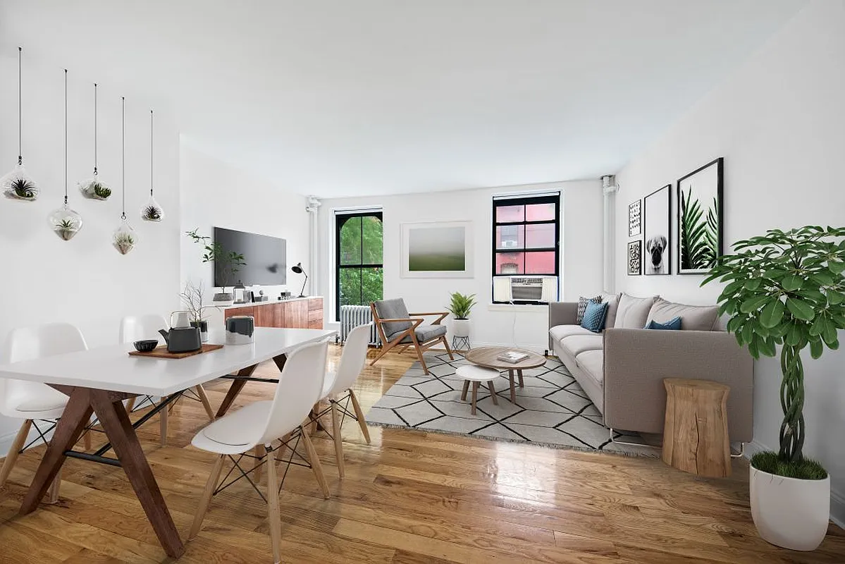 138 Baltic Street, Unit 3C Brooklyn, NY 11201 - Photo 1 of 10 a living room with furniture potted plant and a window