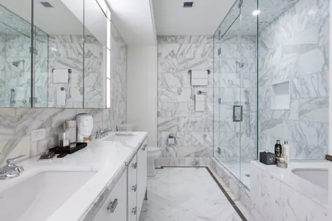a bathroom with a bathtub sink and toilet