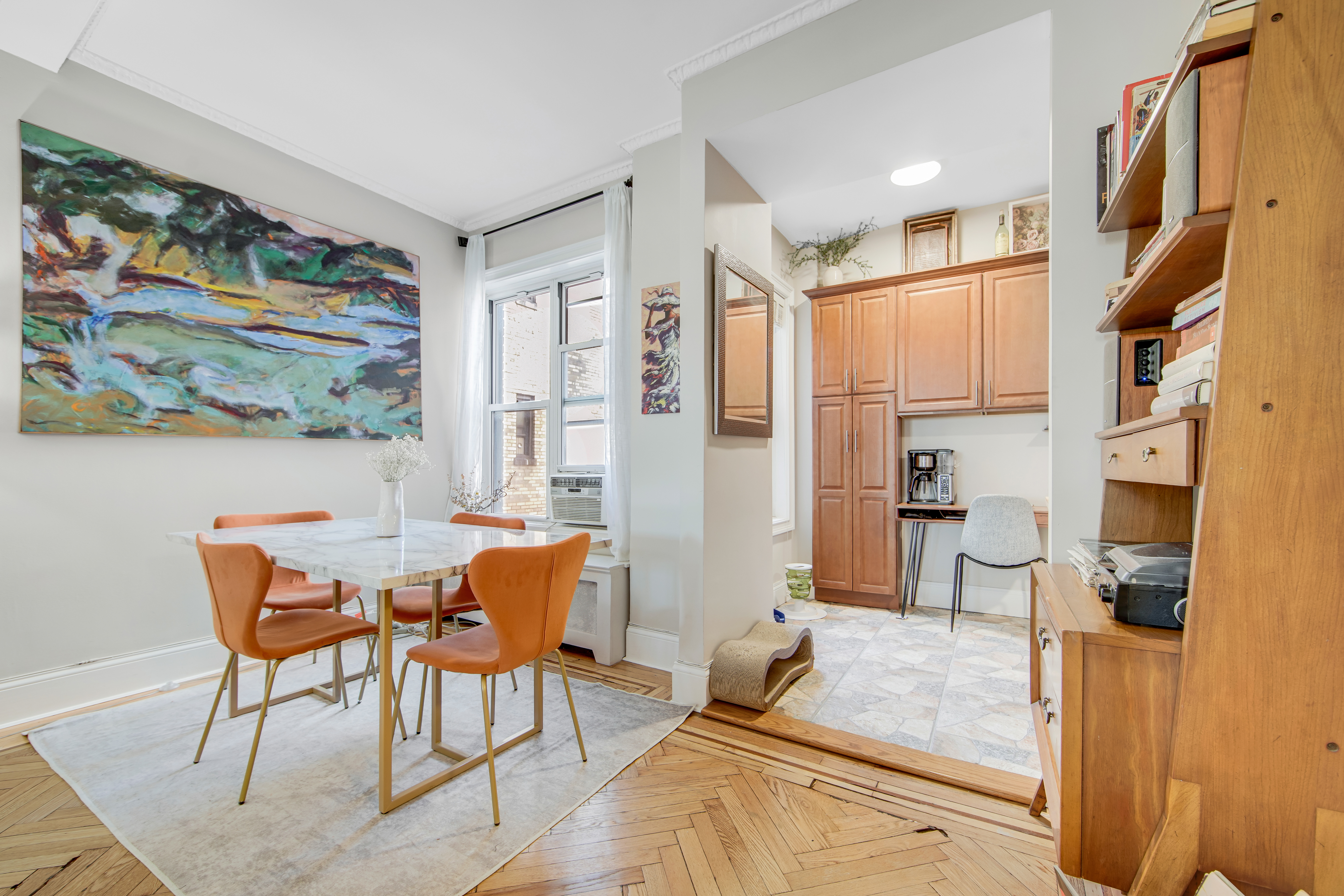 165 West 91st Street, Unit 15B Manhattan, NY 10024 - Photo 3 of 24 a view of a dining room with furniture a rug and wooden floor