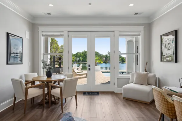 a roof deck with wooden floor and fence