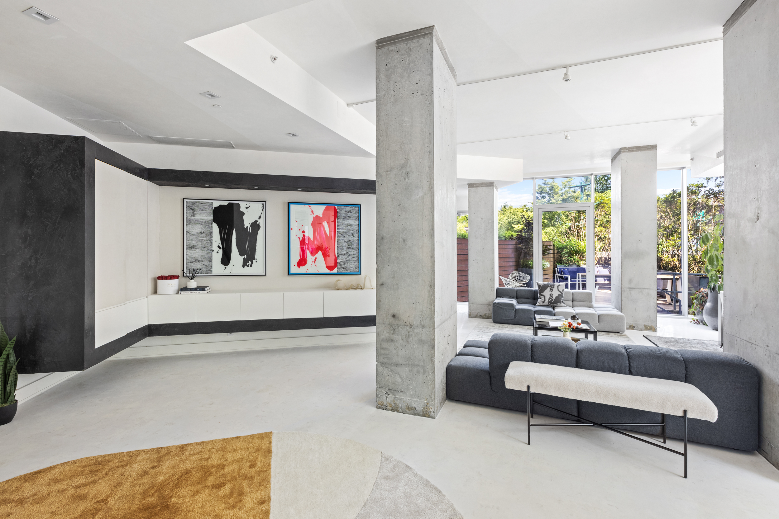 471 Washington Street, Unit 1B Manhattan, NY 10013 - Photo 6 of 17 a living room with furniture and a flat screen tv