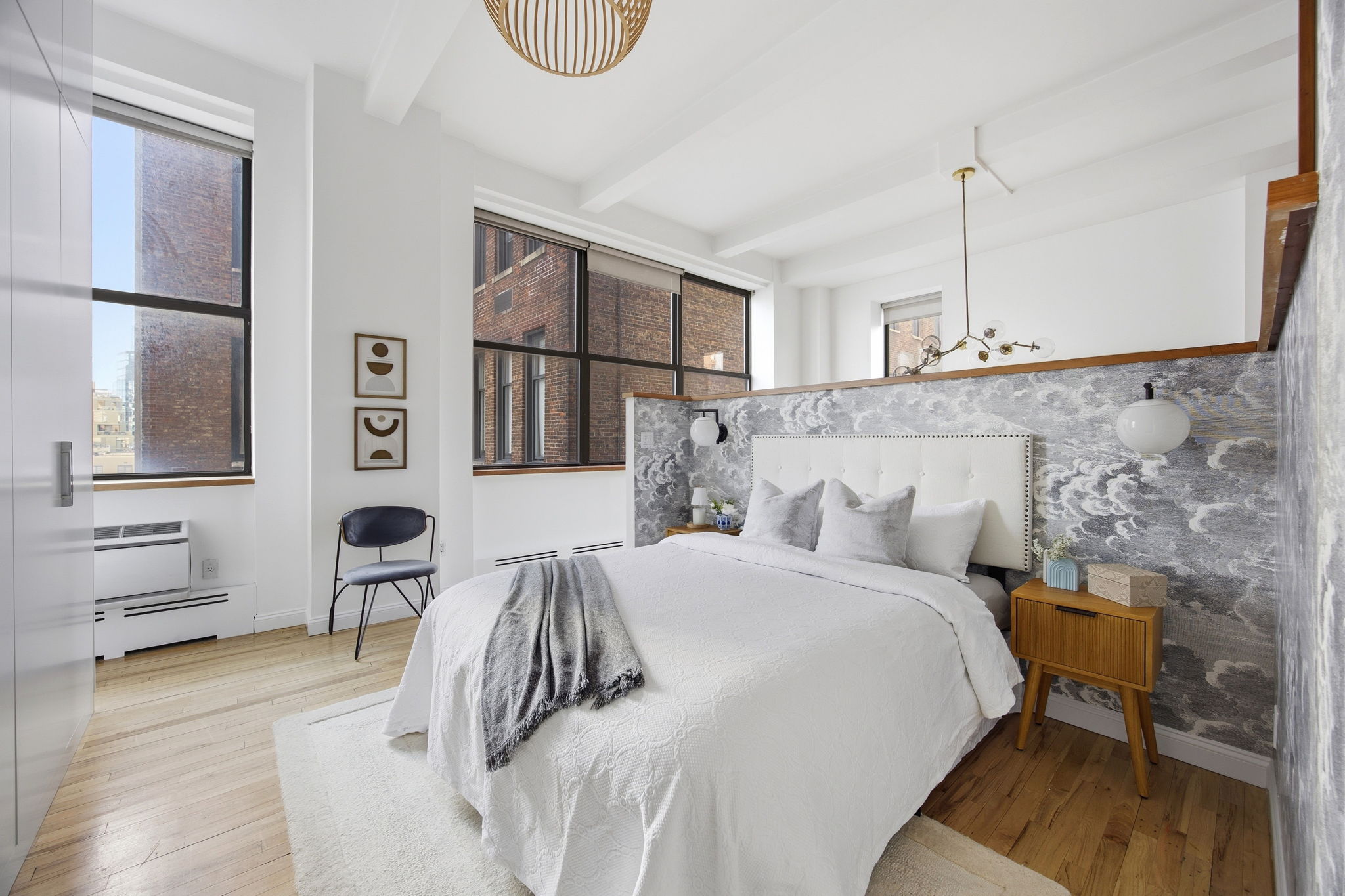 114 East 13th Street, Unit 6B Manhattan, NY 10003 - Photo 11 of 12 a bedroom with a bed and wooden floor