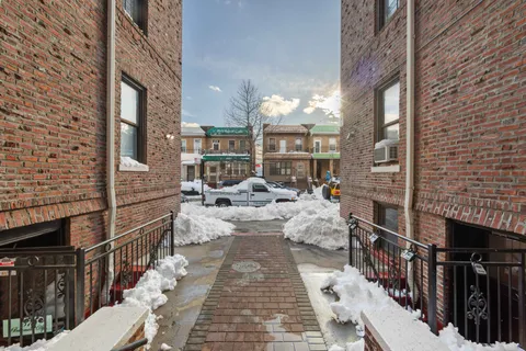 a picture of a brick building with many windows