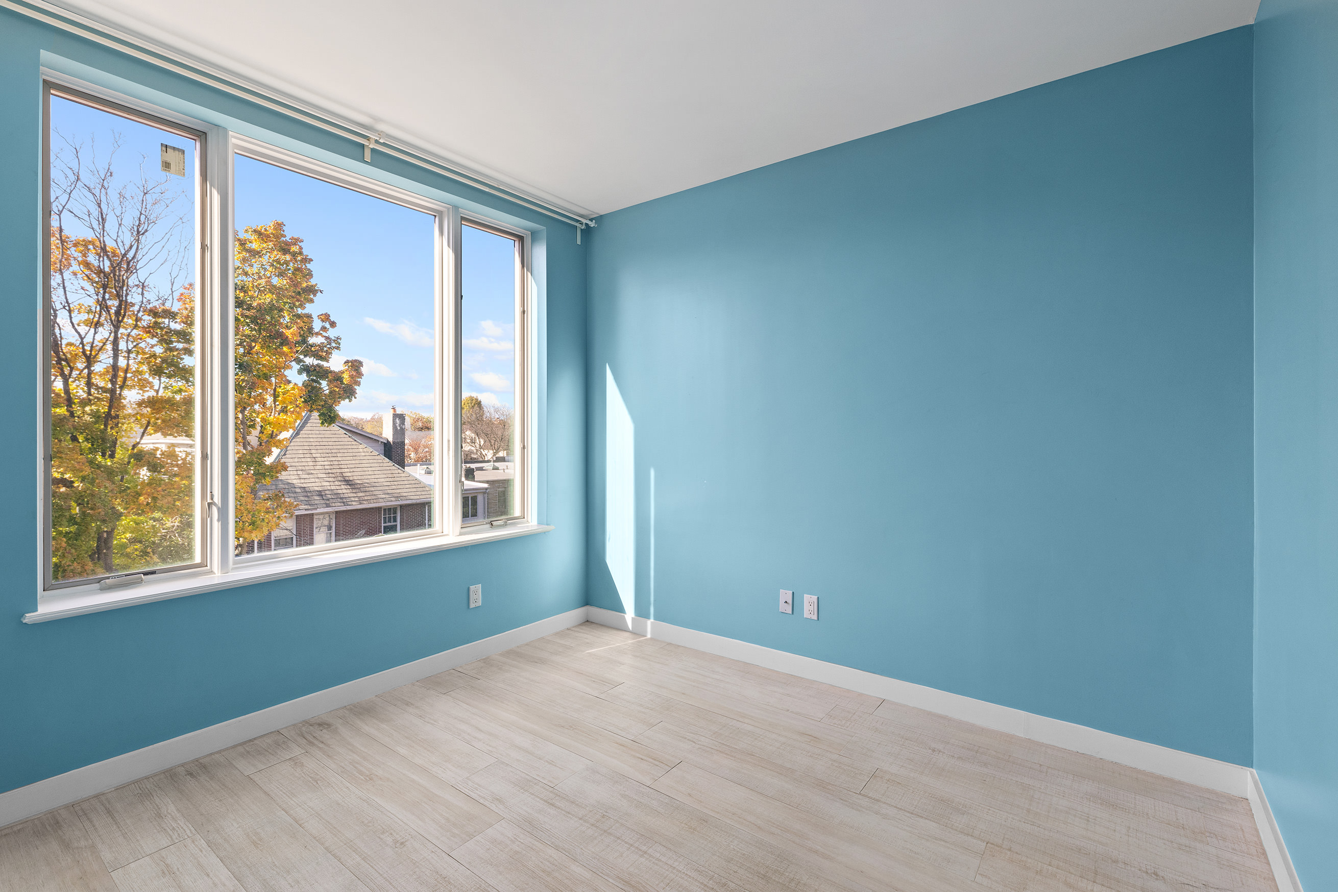 1972 Ocean Avenue, Unit 4A Brooklyn, NY 11230 - Photo 14 of 18 a view of an empty room with a window