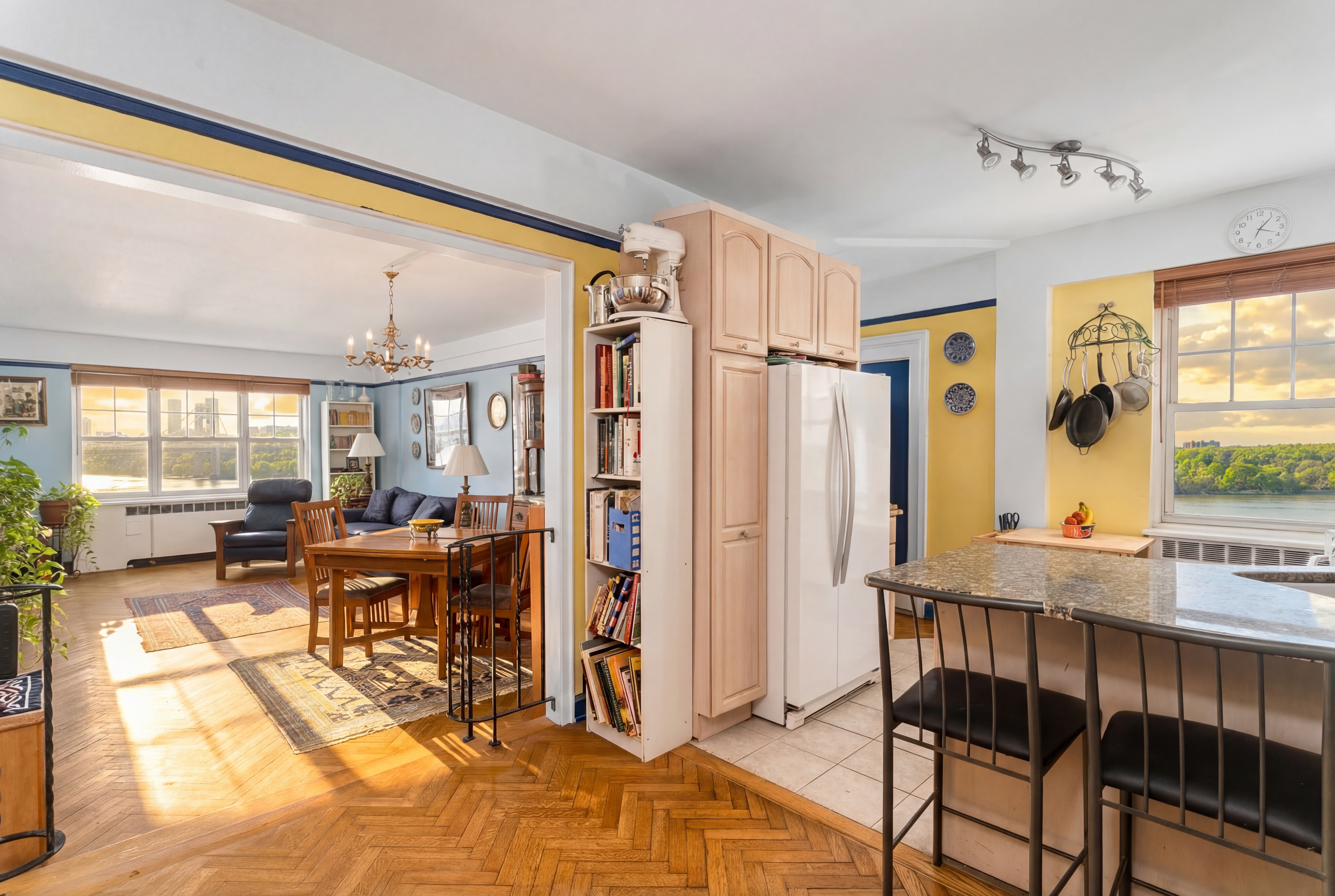 180 Cabrini Boulevard, Unit 61 Manhattan, NY 10033 - Photo 18 of 33 a living room with furniture a large window and dining table