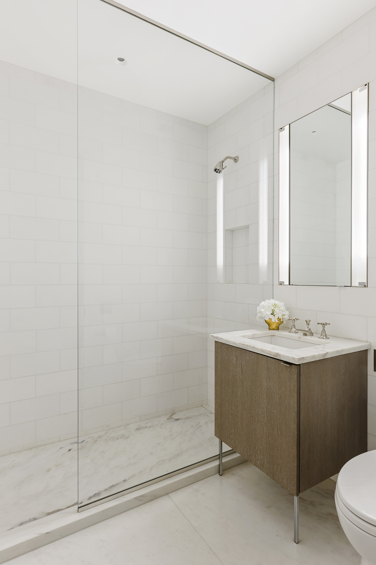 7 Harrison Street, Unit ATELIER Manhattan, NY 10013 - Photo 18 of 24 a bathroom with a sink a toilet and shower