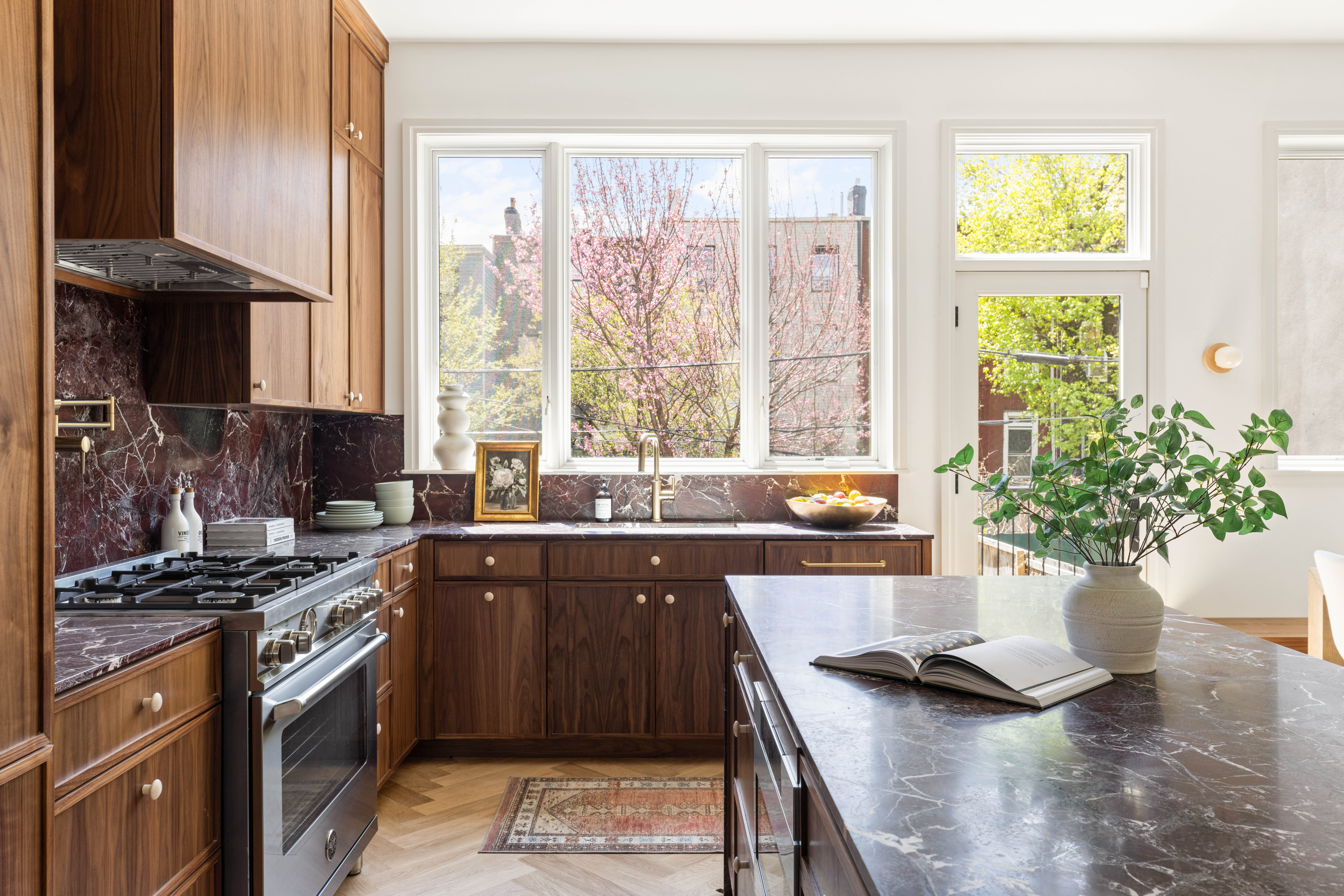 196 Monroe Street Brooklyn, NY 11216 - Photo 6 of 22 a kitchen with a sink and stove top oven