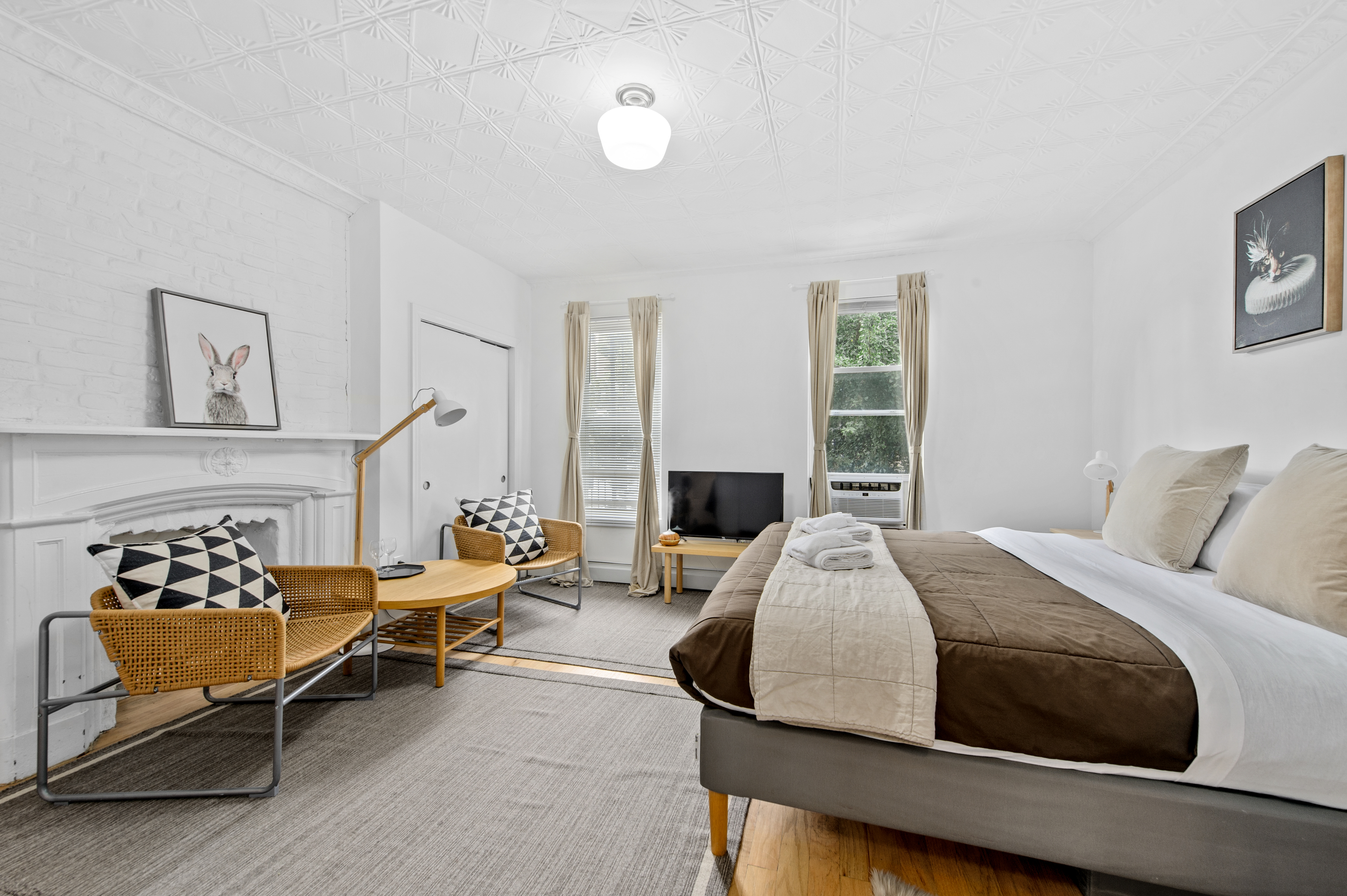 185 A Powers Street, Unit 1 Brooklyn, NY 11211 - Photo 2 of 13 a bed room with a bed and a chair