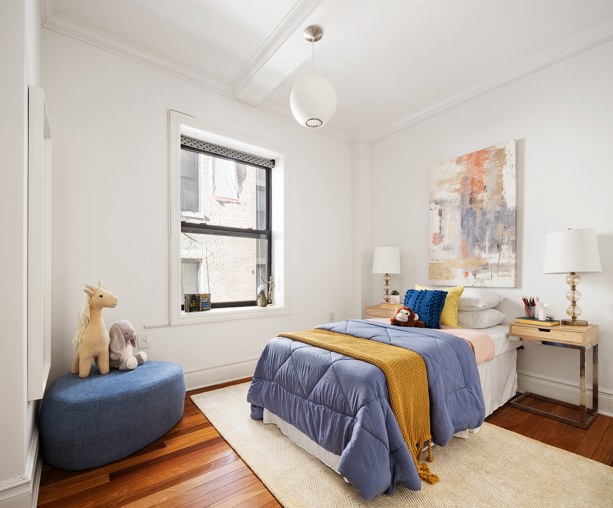 203 West 81st Street, Unit 3A Manhattan, NY 10024 - Photo 9 of 12 a bedroom with a bed and wooden floor