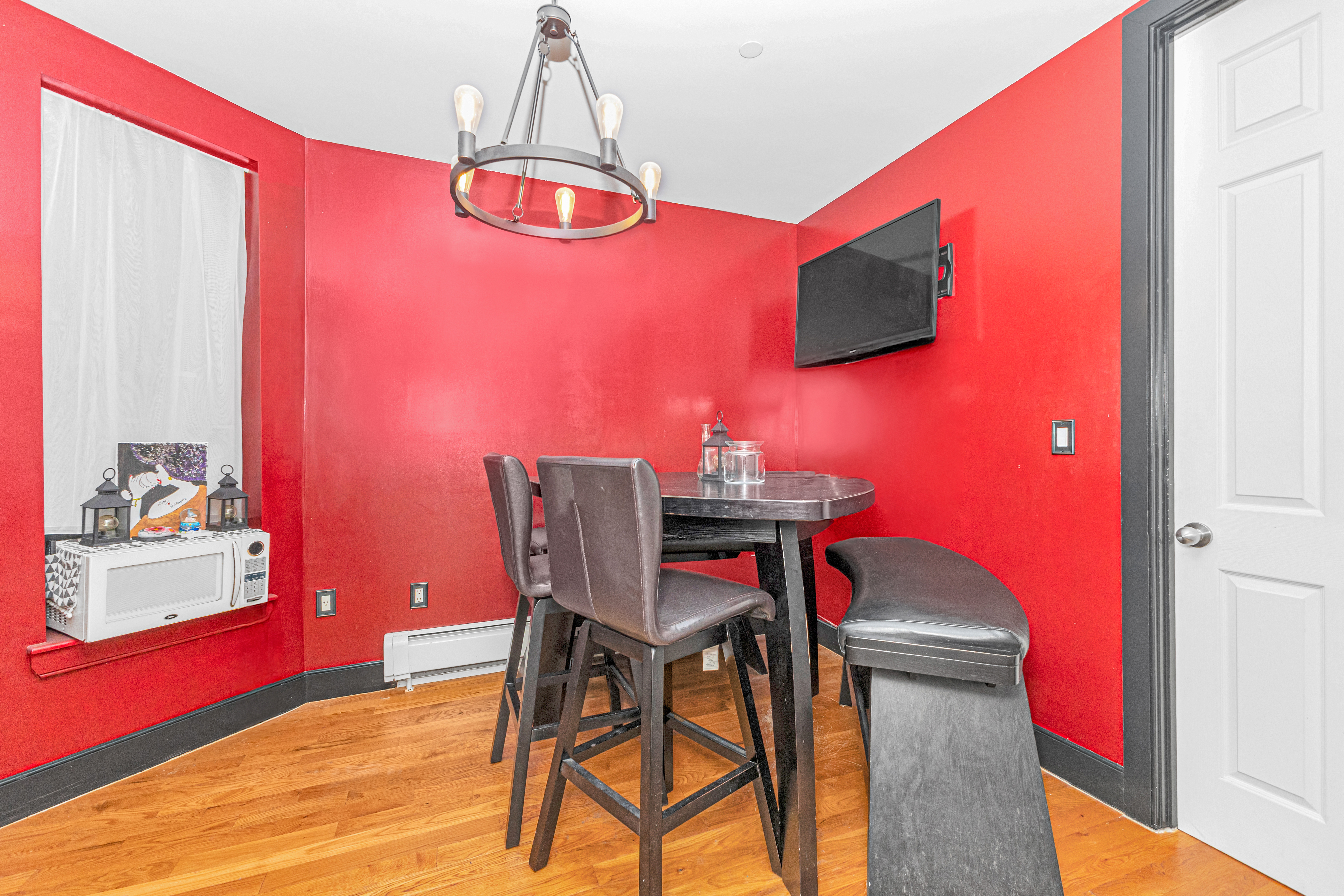786 Madison Street, Unit 3B Brooklyn, NY 11221 - Photo 5 of 11 a view of a dining room with furniture and chandelier